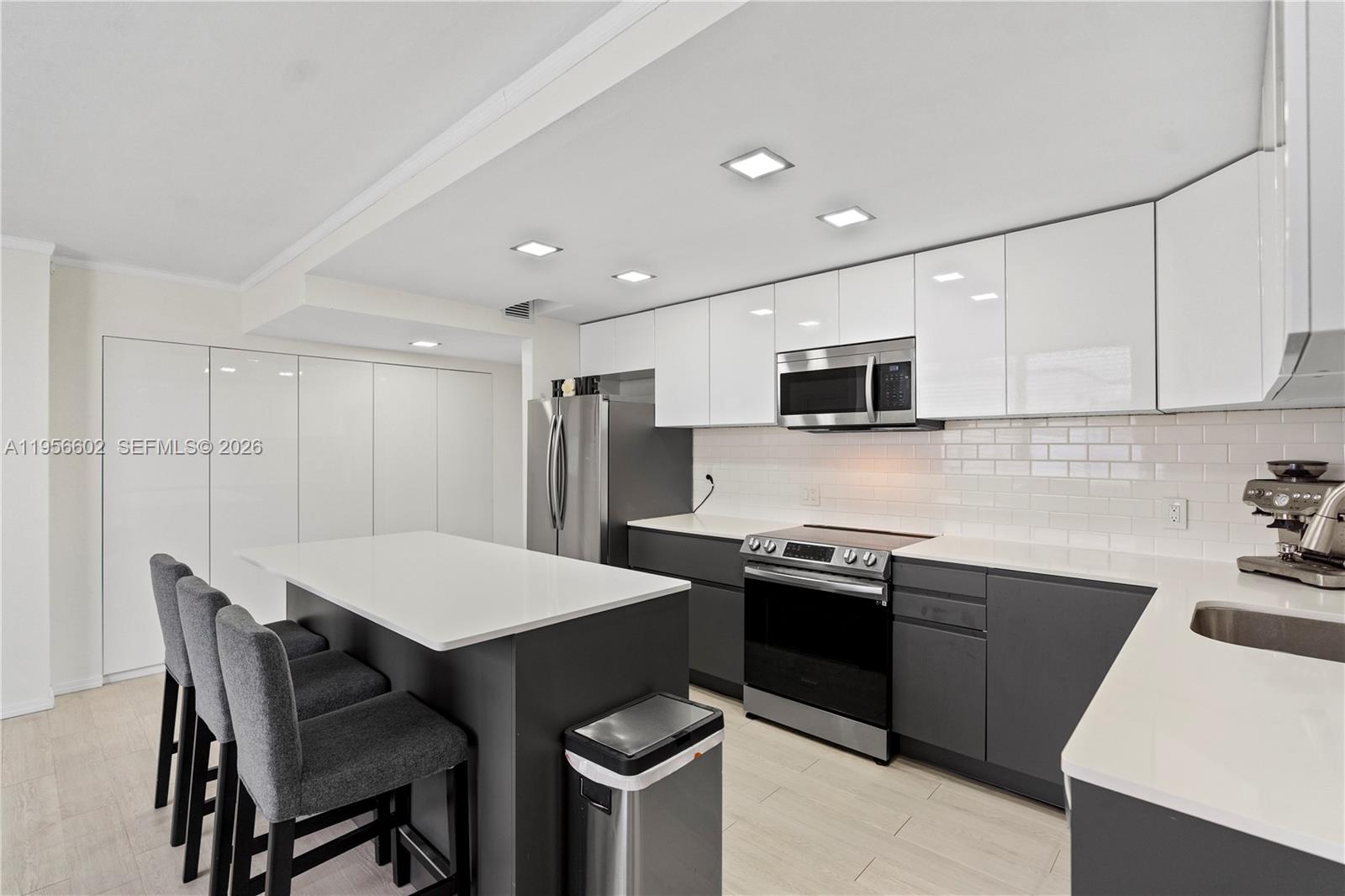 Spacious penthouse three-bedroom condo located in the heart of Aventura, featuring 24/7 security and a central location. This completely remodeled residence offers a well-designed layout with generous living spaces, plenty of windows, and abundant natural light throughout. The remodeled open kitchen is equipped with state-of-the-art appliances, high-quality finishes, and ample cabinetry, opening to a large living and dining area ideal for everyday use and entertaining. Updated lighting throughout. A key feature of this unit is the oversized enclosed balcony, providing substantial additional space that can be used as a family room, office, or sitting area. Spacious main bedroom includes an ensuite remodeled bathroom and a custom-made closet. Secondary bedrooms are well proportioned. A washer and dryer are located inside the unit. Unique setting within the community as residents enjoy a bayfront pool with views of the Miami skyline, beautifully green lawns, and direct access to the bayfront. This gated community offers a rare connection to nature, with open green spaces and tranquil waterfront surroundings. This three-bedroom condo in Aventura offers strong value given its size, condition, and location. Situated in Aventura—known for its highly rated schools, the condo is close to houses of worship, Aventura Mall, fine dining, shopping, beaches, and two international airports. An excellent opportunity to own a fully remodeled penthouse condo in a prime Aventura location.