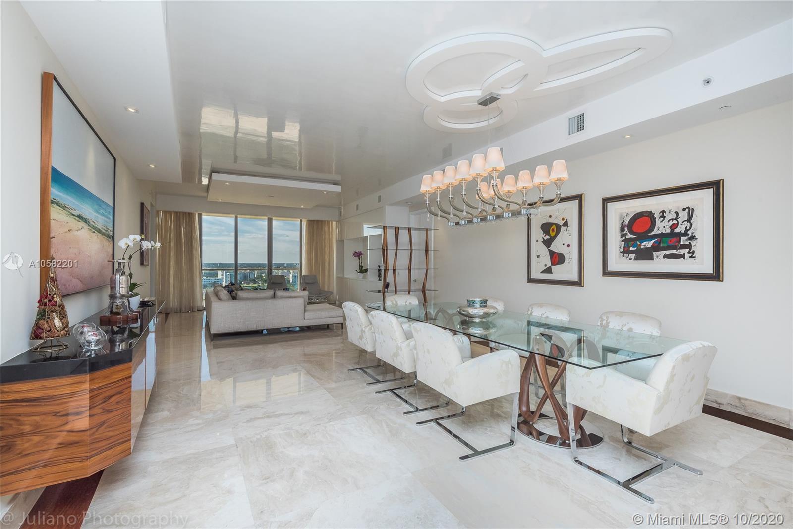 PROFESSIONALLY DESIGNED SHOWCASE! SHOWS LIKE A MODEL! Luxury finishes throughout this DIRECT oceanfront gem. Panoramic vistas of the ocean, city, and bay views. No expense has been spared from this beautifully executed condo.  A TRUE DELIGHT! The endless list of luxuries includes marble floors, drop ceilings, motorized blinds, and a customized floor plan for more expansive luxury living.  Resort living at its best.
Built-in wine cellar in the kitchen. 14000 SF Exclusive access to St Regis amenities. Concierge and Butler on staff, 24-hour dining service. Remede Spa onsite. Walking distance to Luxury Fashion Shopping at Bal Harbour Shops, exquisite collection of designer boutiques and restaurants in a tropical garden setting. An internationally renowned shopping destination!