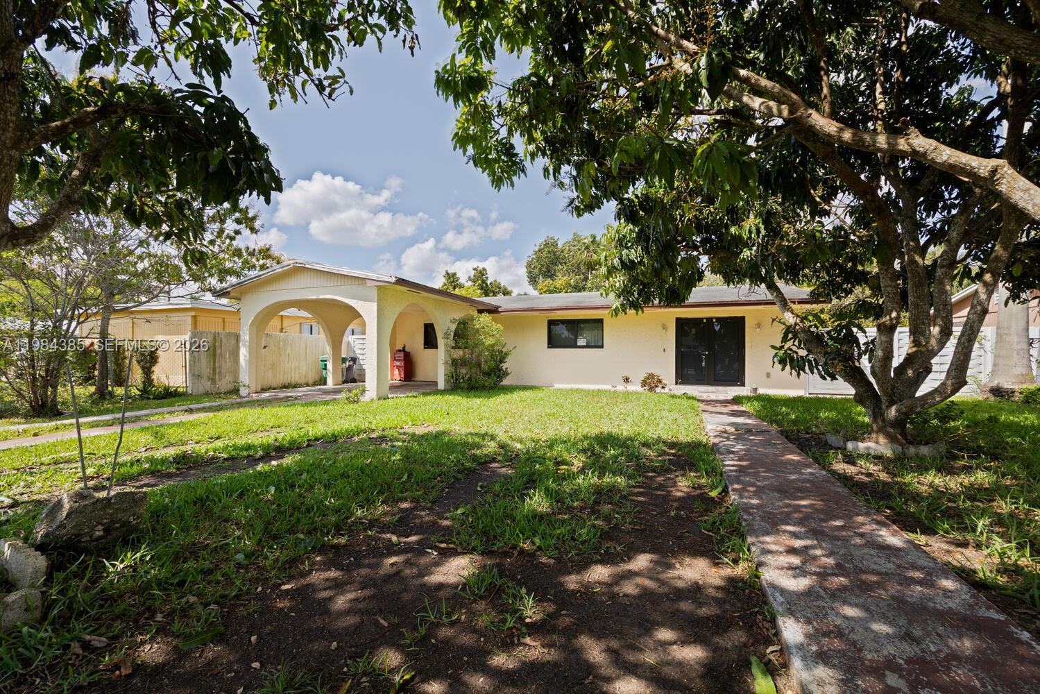 Diamond in the rough in a highly desirable neighborhood! The home features all tile flooring throughout, brand new impact windows and doors already installed, and a spacious fenced yard—perfect for pets, entertaining, or future enhancements. Enjoy mature fruit trees that add charm and character to the outdoor space, along with a convenient carport for covered parking. With great bones , this property is the perfect opportunity to create your dream home. Don’t miss out on this home with endless possibilities!