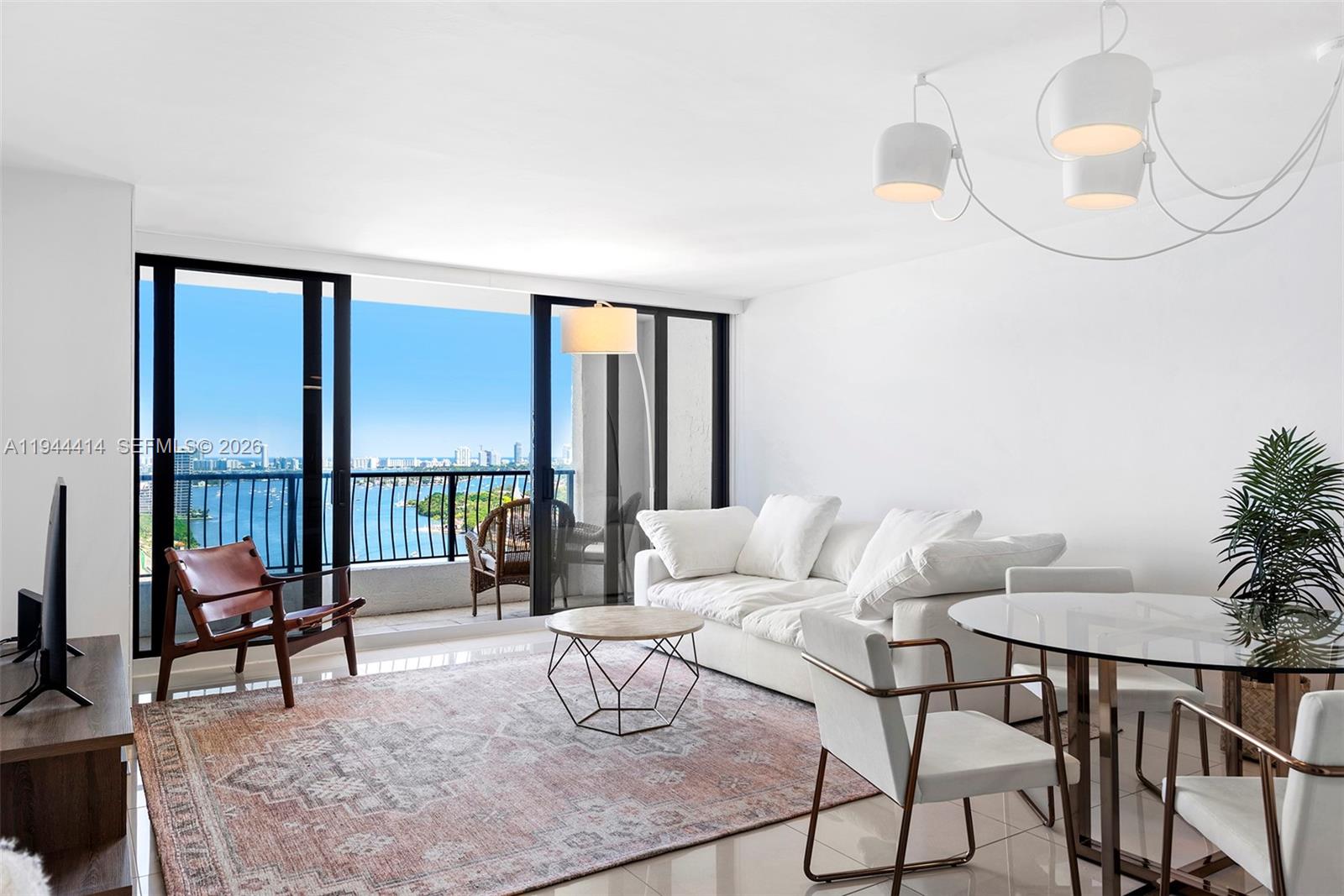 Welcome to the premier spacious 1-bedroom line at The Venetia offering sweeping direct Bay views from both the living area and the primary suite! This fully renovated, turnkey residence features new flooring, an upgraded kitchen, in-unit washer/dryer, built-out walk-in closets, and complete hurricane-impact glass throughout. The Venetia offers a 24/7 attended lobby and resort-style amenities including a waterfront pool, tennis, pickleball and basketball courts, on-site restaurant, salon, and fitness center. Ideally located with quick access to Downtown, Brickell, Miami Beach, and minutes away from the Metromover and trolley. All assessment work for the unit has been completed! Current assessment is $269.34/month with an approximate remaining balance of $20k total. Comes with 1 valet spot. Don't miss out on an exceptional opportunity for Bayfront living in one of the best full-service buildings in Edgewater with unmatched connectivity. Easy to show!