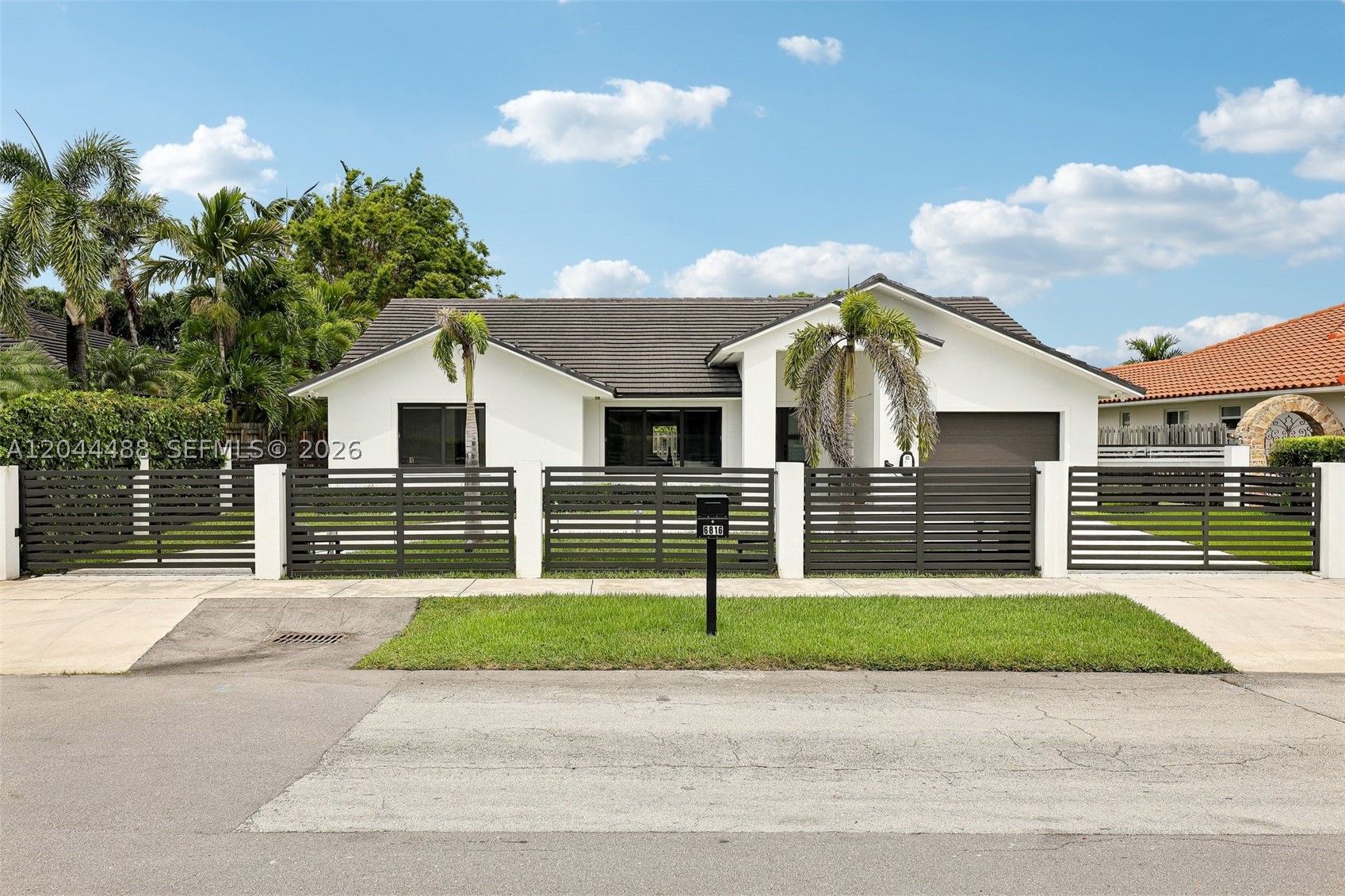 Stunning, fully remodeled 3-bedroom, 2.5-bathroom home offering 2,260 sq ft of refined living in one of Miami's most coveted southwest neighborhoods. Like new from top to bottom — roof, A/C, and impact windows all updated within the last five years. Step inside and experience elevated design throughout. The modern, spacious kitchen features premium finishes and sophisticated cabinetry that flows into bright, open living areas. A statement wine wall anchors the space, perfect for the discerning entertainer. Bathrooms are designed with luxury tile work, designer fixtures, and spa-inspired details. The primary suite offers two walk-in closets and a beautifully appointed en-suite. Two additional bedrooms share a stylish Jack and Jill bathroom.
Outside, a large circular gated driveway delivers privacy and curb appeal, complete with an electric vehicle charging station. The expansive backyard has ample space for a pool and outdoor entertaining.
Centrally located off Sunset Drive and SW 89th Ave — minutes from the Palmetto Expressway, Dadeland Mall, Baptist Hospital, South Miami, and Coral Gables. No HOA