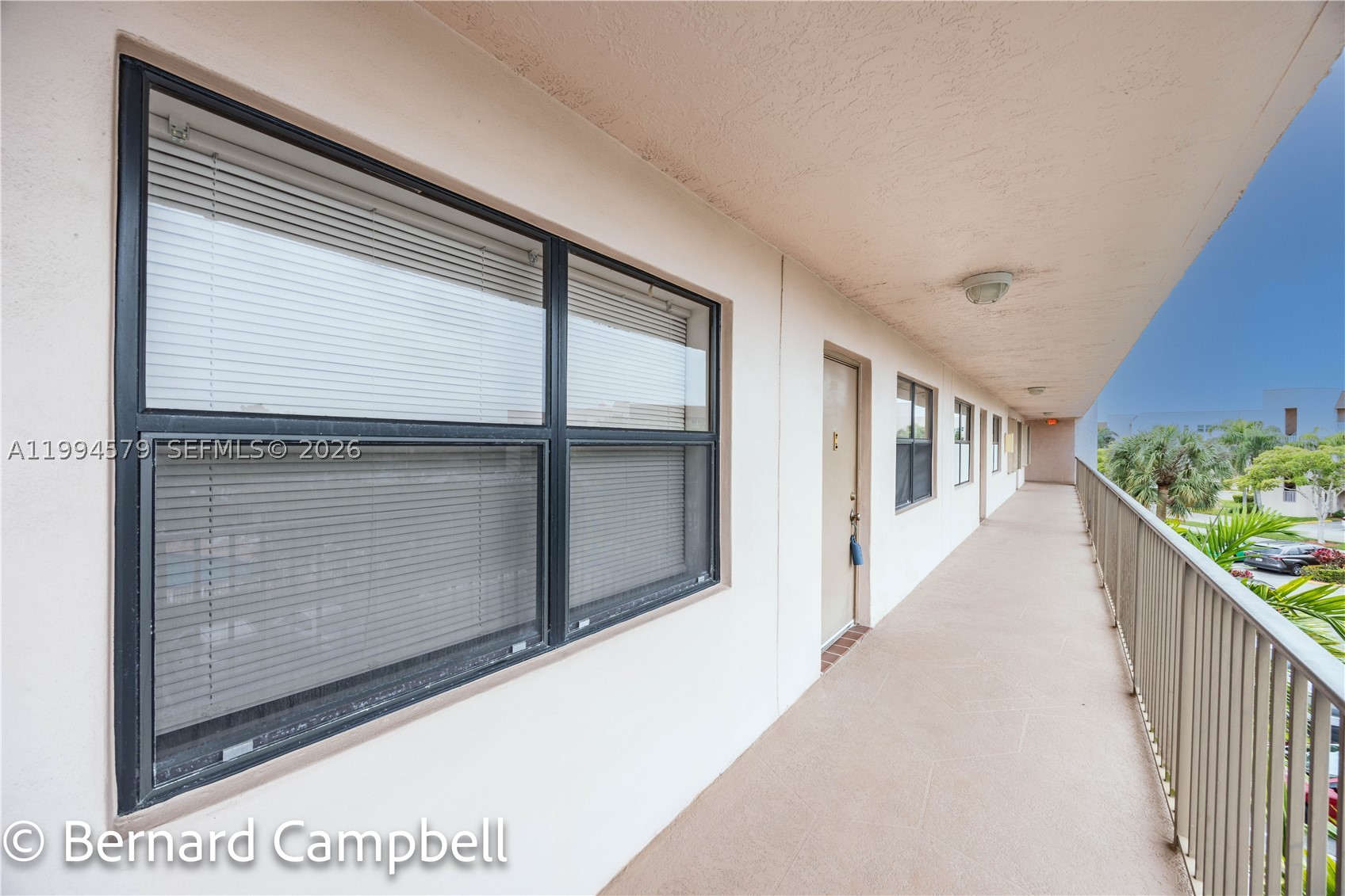 The only GATED section of Sunrise Lakes phase IV offers a beautiful and spacious REMODELED UNIT condo 1370sqft, 2br/2br with a serene water-view and golf course from the Master bedroom and balcony. Kitchen is open and is equipped with stainless steel appliances and custom cupboards and eat-in area. Wood tile floor throughout. This condo is very efficiently laid out which family, living and dining room. Condo has generous interior specious closets. The community comes with all the amenities you can think of from gym, pool, tennis court to a billard room. Sizable laundry room with washer and dryer inside the unit. Never pay for water and exterior insurance again, it's included. Association claim 55+. Won't last. Book an appointment today.