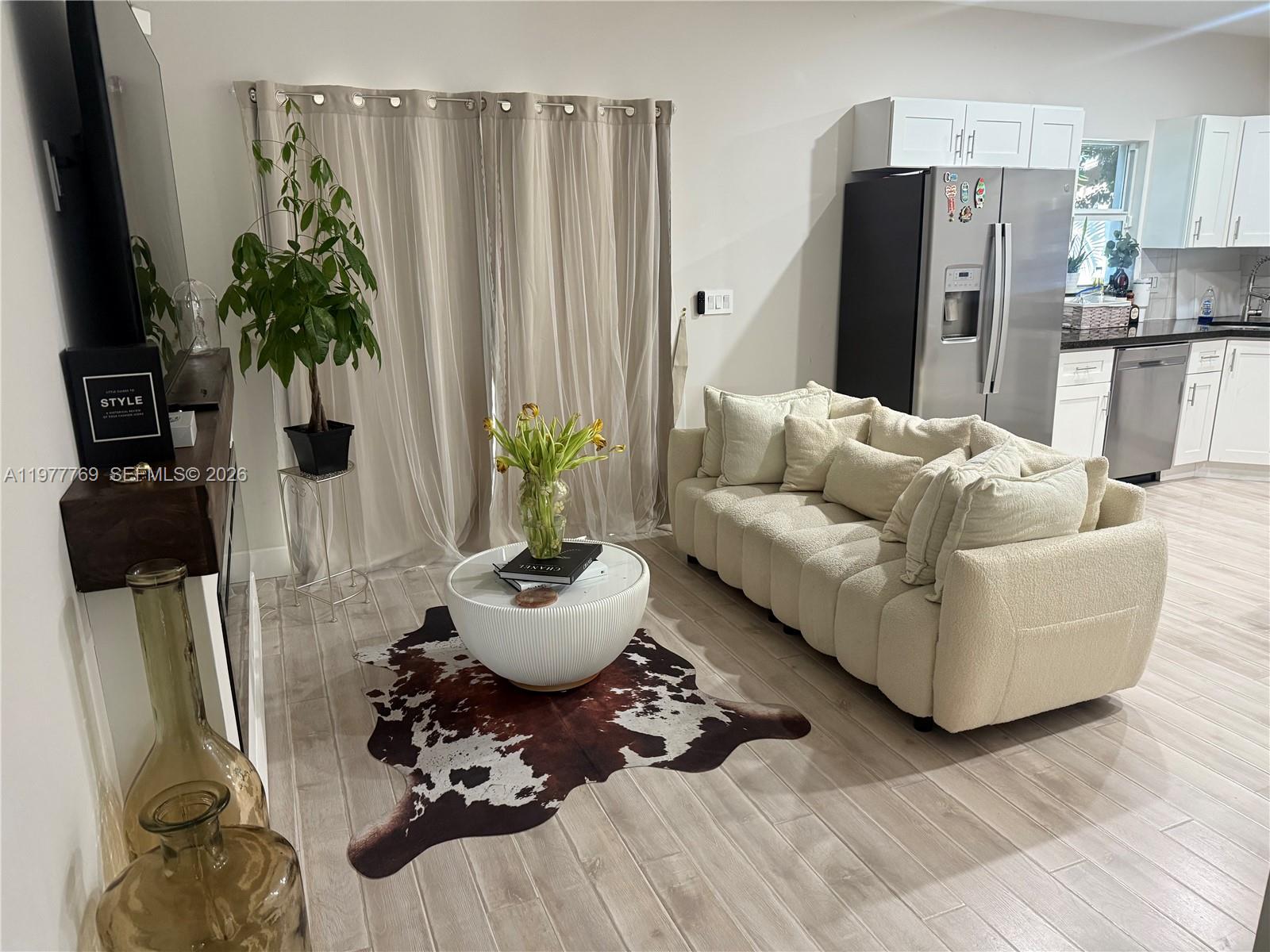 ASSUMABLE VA LOAN-6.250% Turn-key 3-bed, 2.5-bath corner-unit townhome with 1-car garage, beautifully maintained and move-in ready. Located at the quiet back corner of the complex for extra privacy and tranquility. Modern upgrades include heat-blocking window tinting and an electric remote-controlled front-door tint. HOA covers exterior maintenance and community insurance; no rental restrictions-great investment potential.