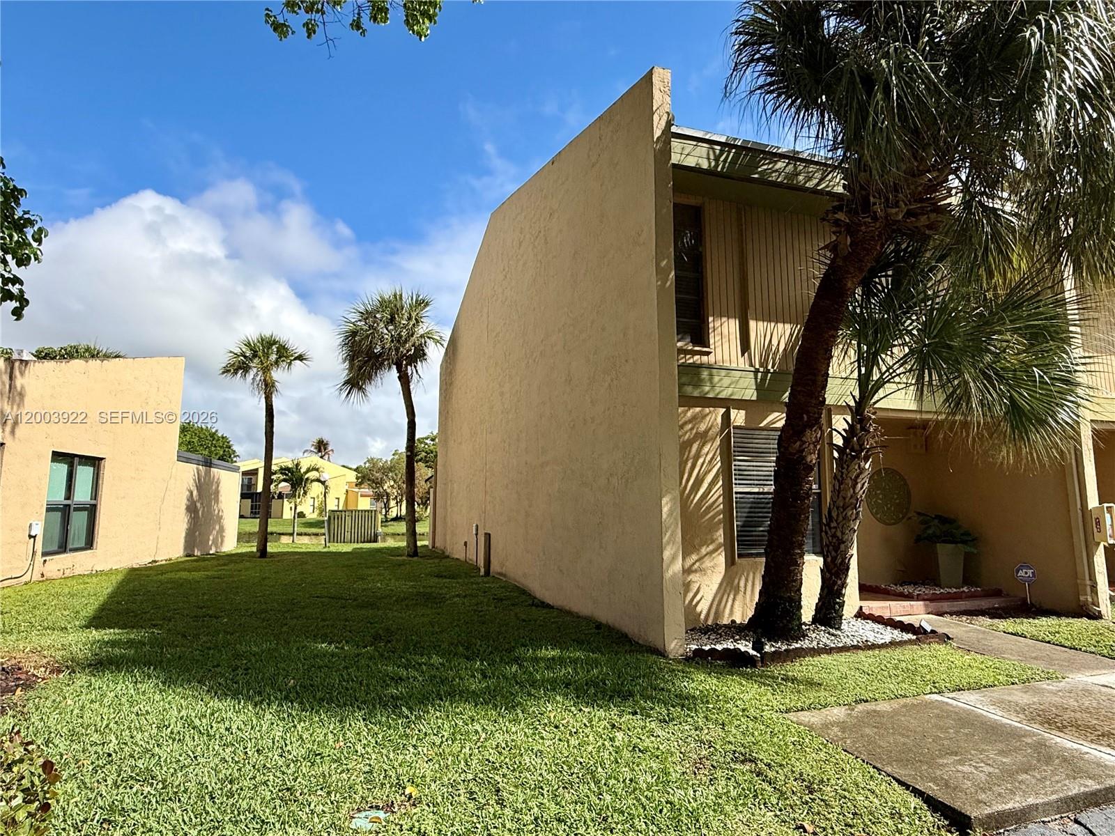Beautiful corner townhouse located in the heart of Pembroke Pines within a safe and well-maintained community. This 3-bedroom, 2.5-bath home features two fully remodeled bathrooms and one half bath. The primary bedroom includes a walk-in closet, along with additional linen closets and exterior storage.

The kitchen is equipped with stainless steel appliances and granite countertops. Spacious laundry room with excellent storage and like-new washer and dryer. A/C unit is approximately 2 years old.

Enjoy a beautiful lake view from the main living area, with the lake directly behind the home—perfect for relaxing or outdoor enjoyment. Two assigned parking spaces located directly in front of the unit.

Community amenities include a clubhouse, swimming pool, and tennis courts.

Association covers cable, internet, roof maintenance, exterior insurance, and common area maintenance.