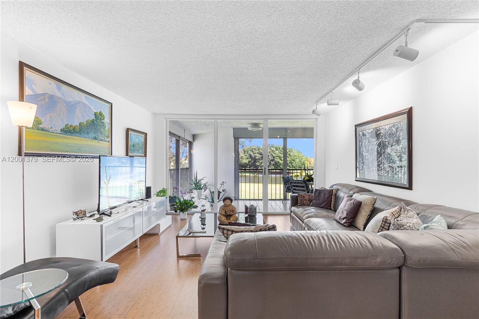 This very spacious & comfortable penthouse level unit offers 2-bedrooms + 2 full bathrooms + powder room & features  wood floors, a large kitchen with breakfast area, full-size laundry, and a newer appliance package. Enjoy the large, screened panoramic balcony with panoramic views of water & golf course, convenient storage bin on the same floor. Located in the prestigious Country Club Apartments with lush surroundings. This impeccable & secure elevator building with renovated common areas. Excellent amenities, pool, tennis courts, walk to the golf club. Compulsory membership to The Bonaventure Town Center with pools, tennis, gym, pickleball, bowling & more!
