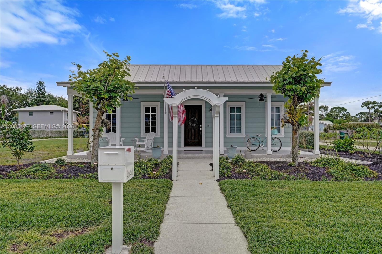 Not your typical Stuart property, this one delivers flexibility, upgrades & future potential w/a separately deeded buildable lot included in the price. This 4 bedroom, 3 bath home built in 2011 sits on a corner lot & includes a separately deeded 50x150 parcel w/potential for an ADU, guest house, pool or outdoor living. Built for durability & peace of mind, the home features impact windows and doors, a metal roof & a whole-house Kohler generator w/a buried 500-gallon propane tank. Interior features include vaulted ceilings, luxury vinyl flooring & a freshly painted interior. The split floor plan offers privacy w/a spacious primary suite featuring a walk-in closet plus additional closet space & versatile secondary bedrooms ideal for guests, a home office or living space. The kitchen is outfitted w/high-end cabinetry, wood dovetail soft-close drawers, custom spice storage, slide-outs & under-cabinet lighting. Laundry/mudroom includes oversized LG smart washer & dryer plus a 2026 Rheem water heater. Enjoy the screened & covered breezeway w/TV & utility sink. The oversized 2-car garage offers exceptional storage & functionality. Additional features include Cat 6 wiring, whole-house audio system, security system, smart thermostat & irrigation covering both parcels. Mature landscaping includes privacy hedging & fruit trees. Ideally located just minutes from Manatee Pocket, marinas, public boat ramp, dining & waterfront activities. City water & sewer. No HOA!