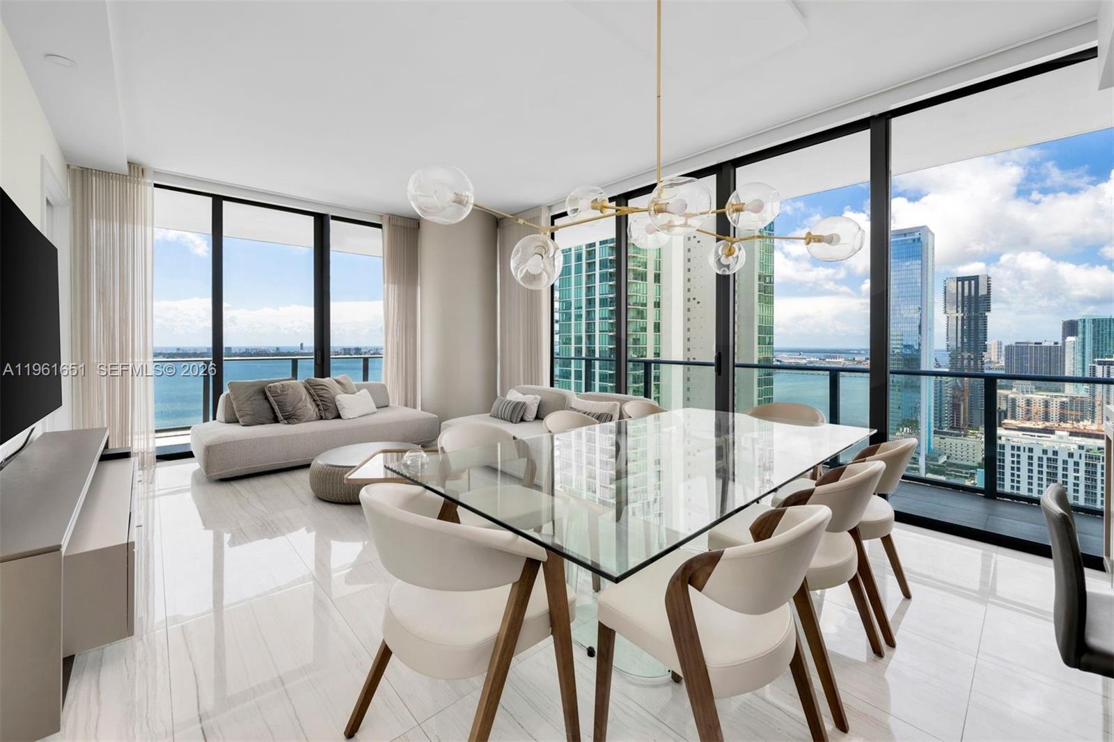 Experience unparalleled luxury and sophistication in this exquisite 4-bedroom, 4.5-bath turnkey residence at Gran Paraiso, set on a premier waterfront location. Natural light floods the interiors through dramatic ceiling-height glass panels, creating a bright and inviting ambiance throughout. Step onto the expansive 8-foot-deep terrace and take in breathtaking panoramic views of Biscayne Bay and the Miami Beach skyline—perfect for relaxing or entertaining.

The unit has been completely remodeled with extensive upgrades and is truly move-in ready. Located in the heart of Edgewater, Gran Paraiso offers exceptional convenience with easy access to Miami International Airport, Coral Gables, South Beach, and Coconut Grove, while being moments from dining, shopping, and cultural destinations.