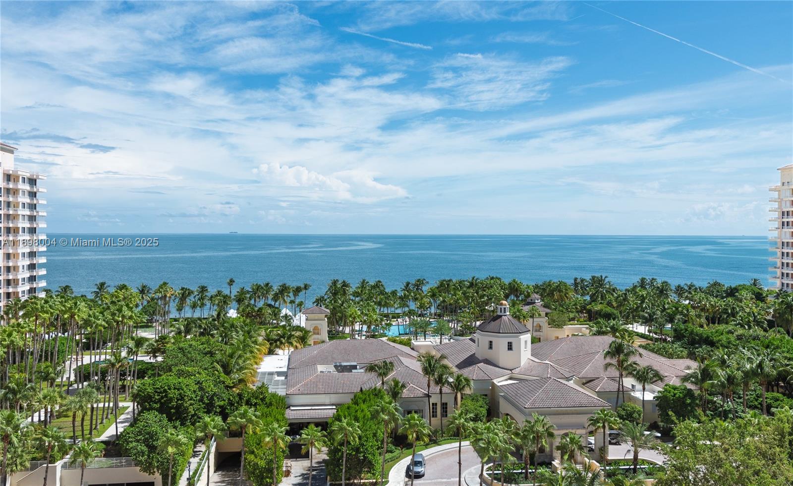 Experience refined island living in this exquisitely remodeled corner residence at The Ocean Club, showcasing breathtaking sunsets and the glittering Miami skyline. This spacious 3-bedroom + den home with staff quarters offers a sophisticated tropical modern design and custom high-end cabinetry throughout. The primary suite features dual bathrooms, and all bedrooms include en-suite baths. The Ocean Club is resort-style family living with a private Beach Club, poolside restaurants, fitness center, spa & beauty salon, Tennis club & more! Key Biscayne is an unmatched island paradise just minutes from Miami’s downtown. Call for a private visit, easy to show!