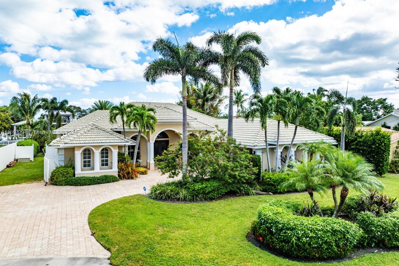 An incredible 105’ water frontage opportunity awaits in desirable Paradise Port on the Intracoastal Waterway! This beautiful home features 4 bedrooms & 4.5 bathrooms, set on a spacious 14k sf lot. Bright and fully furnished, the home is move-in ready, complete with a serviced generator and lift/davits on a large dock. The expansive yard is ideal for outdoor living and entertaining, with a patio, pool and Tiki Pergola. Experience premium waterfront living on a coveted street in Paradise Port and unincorporated Palm Beach County with significant tax advantages in unincorporated Palm Beach Gardens. Please call to schedule your private viewing today.