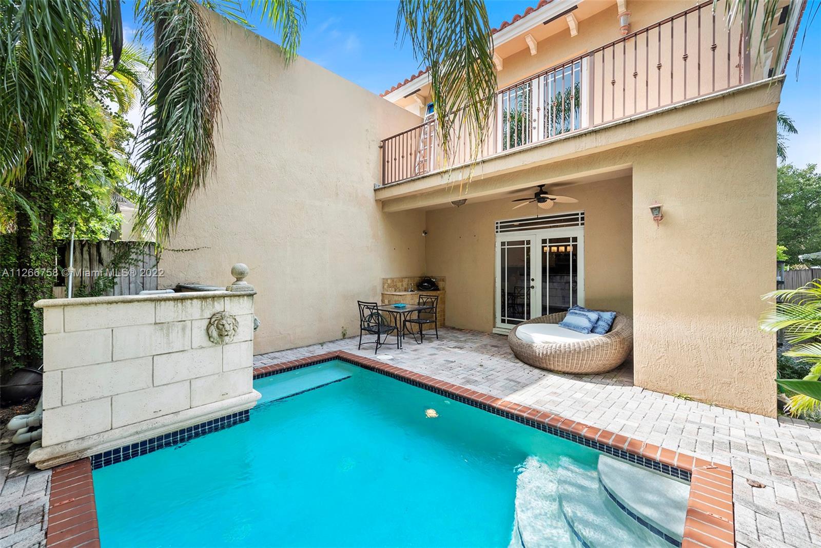 Welcome to your new Coconut Grove home! This  3bed 2.5 bath sophisticated and elegant luxury townhome is located in the heart of Coconut Grove. From the moment you walk in, you will appreciate the volume ceilings, gleaming marble floors throughout and the abundance of natural light streaming in from the balconies located off of each bedroom. The gourmet kitchen features wood cabinetry and granite countertops, while the custom millwork adds a touch of luxury.  The intimate private pool area with a covered porch and wet bar are perfect for enjoying Florida's sunshine. The attached 1 car garage makes everyday access a breeze. Don't miss this wonderful opportunity to own in one of Miami's most desirable neighborhoods! 92% walkability most errands can be completed by walking.