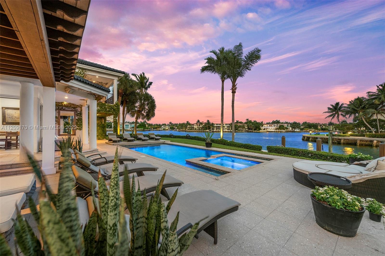 “The Premier Waterfront Property in the Gated Community of Golden Isles!” Stunning One-of-A-Kind Waterfront property on triple lot (38,844 sq.ft. of land).  Point lot offers sunrises and sunsets and fronting both the Intracoastal on one side and canal on the other.  420+ feet of seawall with southeast views facing Golden Beach. Extensive seawall ideal for accommodating very large yachts, water toys located in a no wake zone with ocean access with no fixed bridges to the Atlantic Ocean. Two-story estate with 7BR/9.5BA + den, family room, playroom, elevator and much more.  Enormous grounds with waterfront covered terraces, heated pool/jacuzzi w/motorized cover, dock, and large backyard making it ideal for entertaining/relaxation with the family. Located between both Miami and Ft Lauderdale.