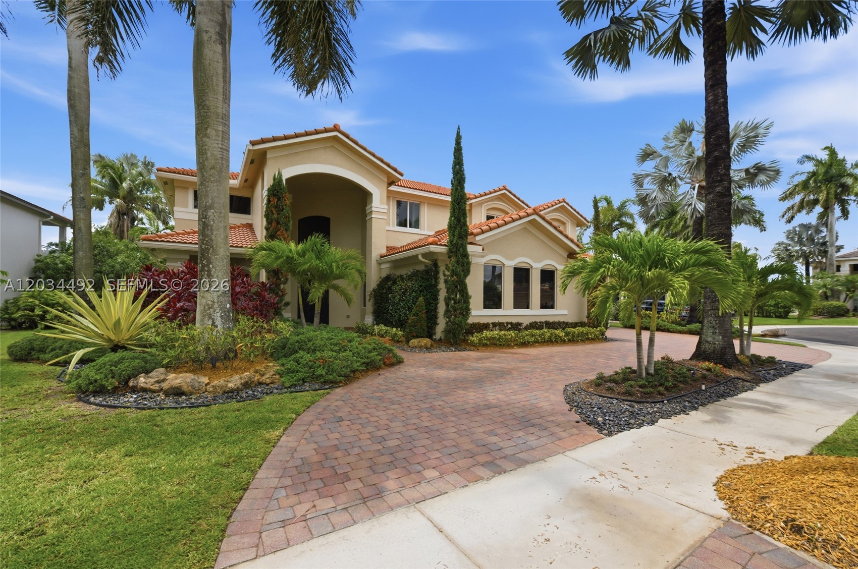 Stunning 5BR, 5BA home plus office and game room, with an oversized 3 car garage  in Weston’s sought-after Savanna community. New 2022 roof with spray foam installation,  Full impact windows and doors 2026, diagonal porcelain tile on the first floor. Cabana baths and spacious game room on first floor (the pool table can stay)  Gourmet kitchen with Sub-Zero refrigerator, full-size wine cooler, Miele dishwasher, steamer and warming drawer, and Dacor stainless steel double ovens, granite countertops and sunny breakfast area. First-floor office with custom cabinetry.  All real wood flooring upstairs with a dual staircase.  Enjoy the private backyard oasis, fully fenced with lush landscaping, heated salt water pool with spa, fire pit and peaceful lake views, perfect for entertaining. Home interior and exterior were repainted 2026, new gutters 2022, and so much more!
