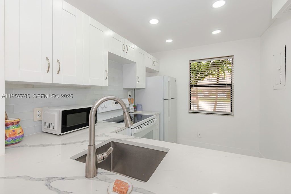 Stunning all remodeled Golf view 1st floor condo with two bedrooms and 2 bathrooms, new Porcelain tiles in bathrooms and waterproof vinyl flooring in the other areas, new white kitchen cabinets, new stainless-steel sink, modern quartz counter tops, washer/dryer inside the unit. Parking space #25, is in front of unit. Internet/TV-Cable included in assn. fee and already installed. Ready to move in. HOA takes 4 weeks for approval process, 700+ credit, single income $37.5k, this one won't last at this price, must see it! close to Sawgrass mills mall, restaurants, plazas, highways I75, sawgrass expressway, 595.