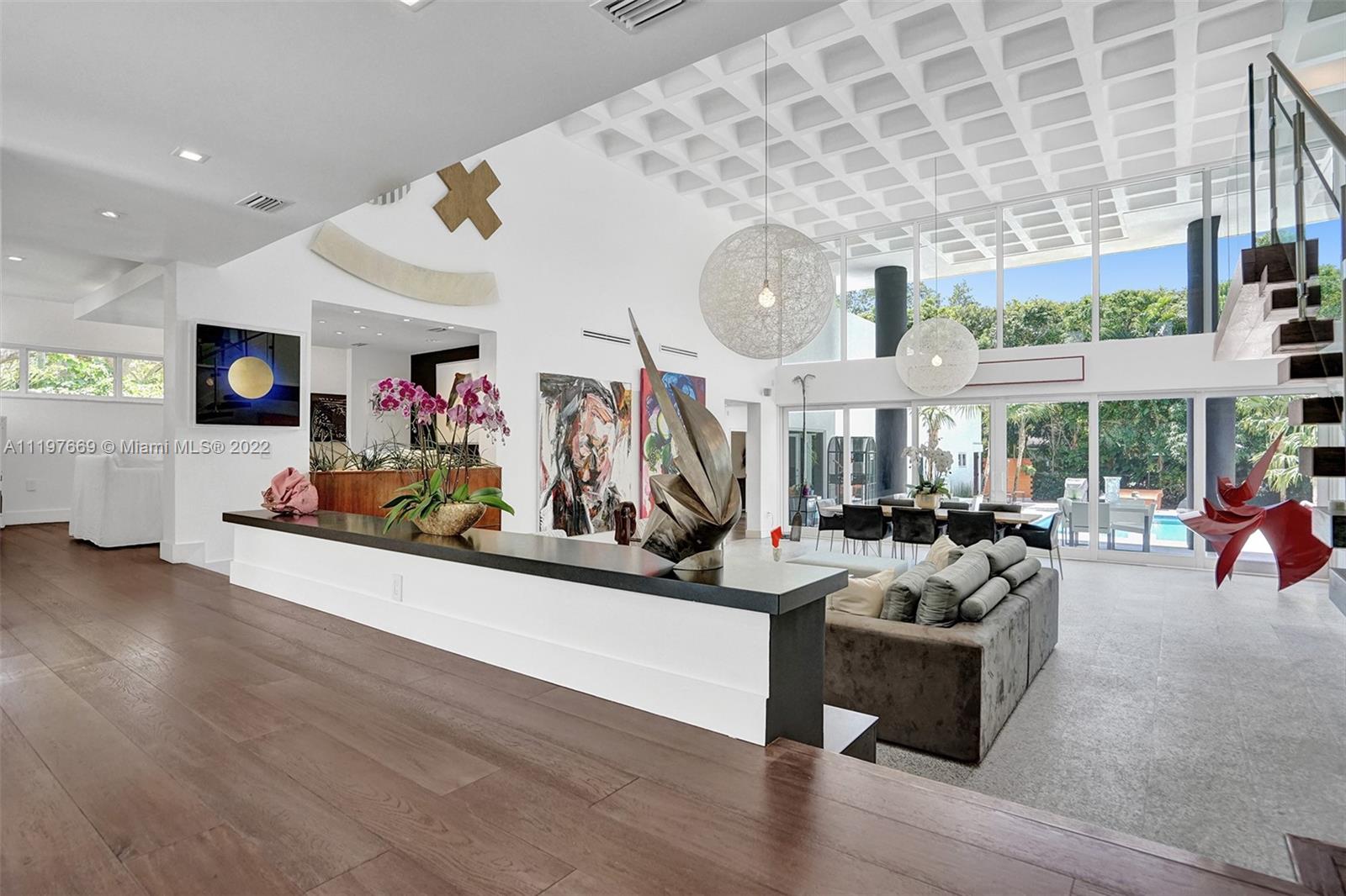 Presenting Casa Moderna in the Northern section of Pinecrest, Newly remodeled 6 bed/6.5 baths modern masterpiece starting with an oversized Porte-cochere entrance with beautiful water features greeting you as you enter this mammoth living/dining area with over 20ft ceiling, fireplace that overlooks an oversized back yard with solar heated, salt water pool. Upstairs you will find your primary bedroom retreat & spa like bath with 2 e walking closets and second fireplace, Downstairs you have separate wing including 3 large bedrooms 2 bath and living room, office or den and walled in garden. Gourmet kitchen with top of the line appliances, 3 car garage with space for 3 more if needed. Nanny suite, brand new roof, impact windows/doors, home generator, new septic tank.