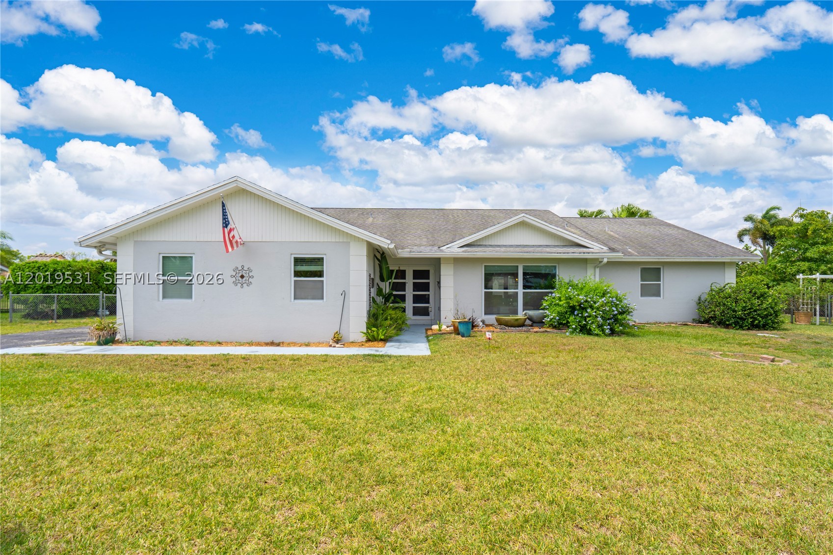 Seller is very motivated and ready to make a deal — bring your buyers! Beautifully updated 3-bedroom, 2-bath pool home on an oversized 27,500 SF lot in sought-after Westbury Estates. Plenty of room for RVs, boats, and all the toys. Inside offers an open split floor plan, renovated kitchen and baths, ceramic tile throughout, and a spacious Great Room made for gathering. Impact windows AND doors plus a newer roof mean lower insurance and real peace of mind. Step outside to your own private backyard retreat: a heated pool, a serene zen garden with gazebo, and mature fruit trees — with room to spare for gardens, expansion, or a dream workshop. Surrounded by South Florida's lush agricultural countryside, yet just minutes from the ocean, the Everglades, and the Florida Keys. Space, privacy, and freedom rarely come together like this. All reasonable offers considered — easy to show. Don't miss it!
