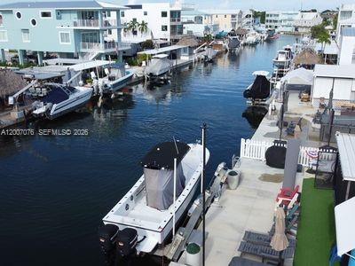 ROGO Exempt Waterfront Opportunity – Extra-Wide Canal, Immediate Bay Access.Rare chance to secure a ROGO Exempt waterfront lot in Key Largo—build now without the typical Monroe County delays.Positioned on an extra-wide canal and the first canal in from Blackwater Sound Bay, this property offers exceptional boating access with minimal idle time to open water—a premium feature for serious boaters.Conveniently located just 55 minutes from Miami, making it ideal for weekend use, full-time living, or a high-demand rental investment.The lot is being offered for new construction, with a renovated and livable trailer already in place, providing immediate use, rental income potential, or a convenient setup while you build.Surrounded by the best of the Keys lifestyle—boating, fishing, dining, and waterfront recreation—this is a high-demand location with strong upside for investors, builders, or end-users looking to create a custom waterfront residence.Build-ready, ROGO exempt, wide canal, prime bay access, and close to Miami—opportunities like this are limited. Act fast.