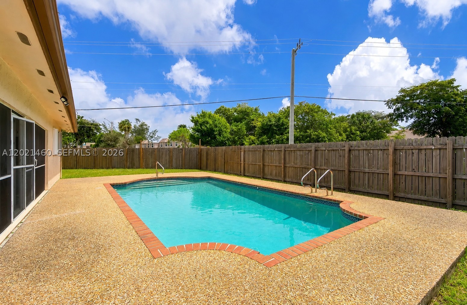 STUNNING CORNER LOT WITH A POOL! NO HOA & NO BACK NEIGHBORS! This beautifully remodeled 5 Bed/2BA pool home features brand new laminate flooring throughout, gorgeous white granite countertops, newer appliances, washer, dryer & water heater. Enjoy the screened patio overlooking your private below-ground pool, plus separate living & dining areas and a spacious walk-in closet. bring your offer today, this one won’t last!