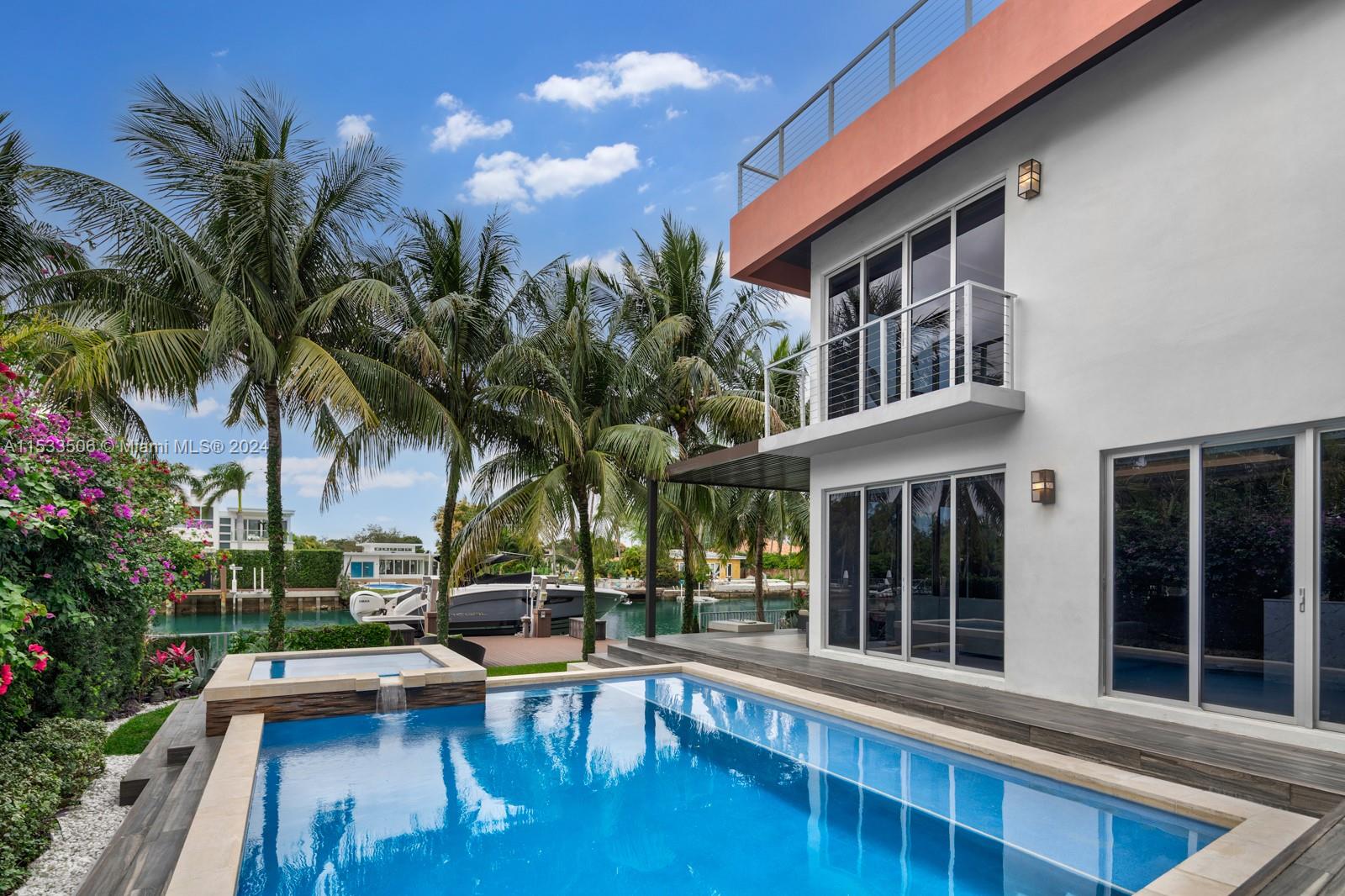 Welcome to Miami Beach’s island of Normandy. This home offers a modern and luxurious island lifestyle with a captivating architectural design and thoughtfully designed interior. This modern home was completed in 2011 and offers 5 bedrooms, 4 bathrooms, 3,271 square feet of living space, 2 car garage, 1,500 sf rooftop with water and golf course views. Over $1 million in renovations, including oak wood floors, marble walls, smart home system, a 16k boat lift, a heated pool and spa with salt system, two jet ski floating dock, outdoor kitchen, soft water system, new AC units, Miele appliances, and more. Situated on a developing street, this home is a solid investment opportunity with no expense spared! Don't miss out on this incredibly elegant waterfront home steps from Normandy Golf Course.