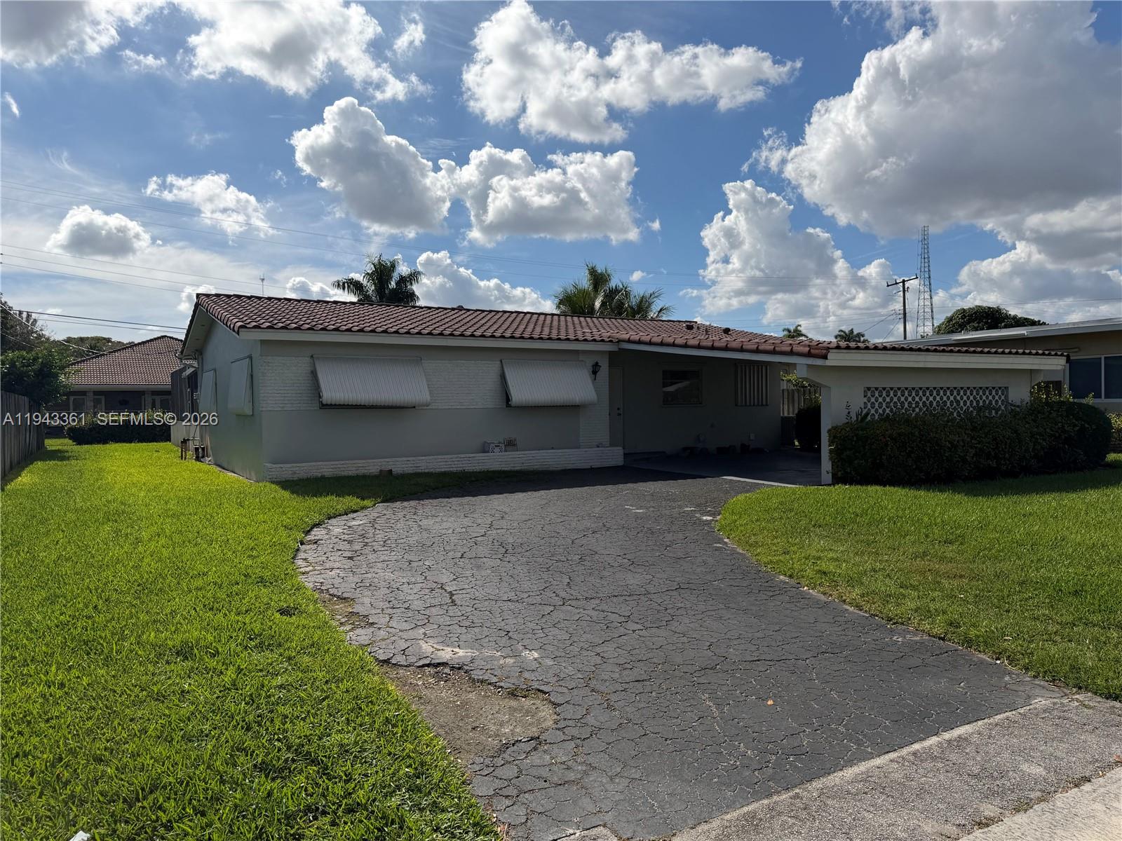 Charming 3BR/2BA home for sale in prime Hollywood location on Hollywood Blvd, just a block from I-95. Features a screened-in pool area, convenient carport, and spacious family room ideal for entertaining. Close to Target, Publix plaza, Train station, police station, and plenty of dining options. Needs some updating and is priced to sell—perfect opportunity for the right buyer! Don't miss this centrally located gem.
