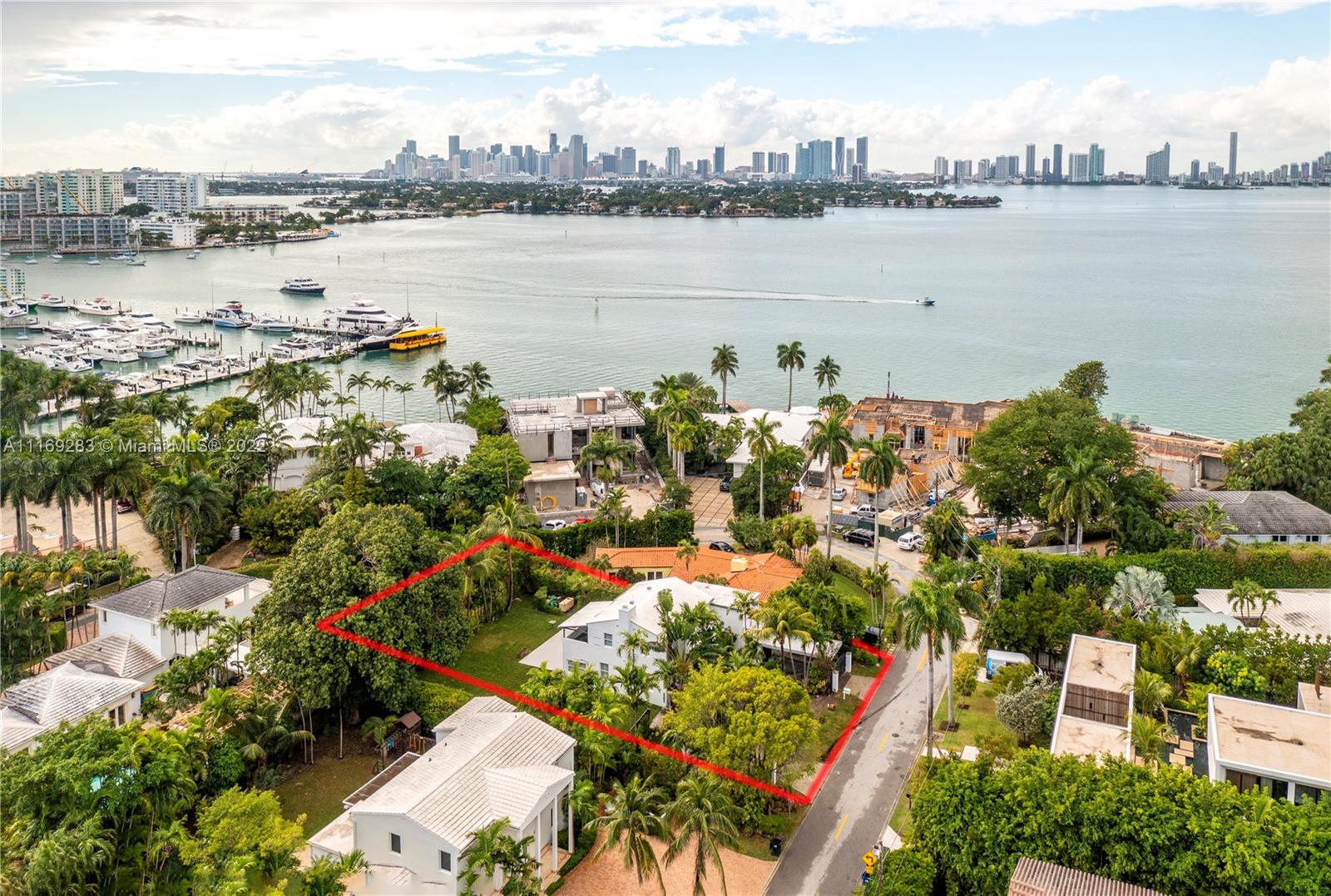 Rare find to own over 10,000 sqft lot on prestigious Sunset Island IV on Miami Beach.  This private gated island is within walking distance to the Sunset Harbor neighborhood.  Gated private entrance to this charming 3/2.5 with separate office/maids quarters with half bath, and 1 car garage. Lush landscape for complete privacy with plenty of frontage and depth for expansion or perfect to build your new custom home.