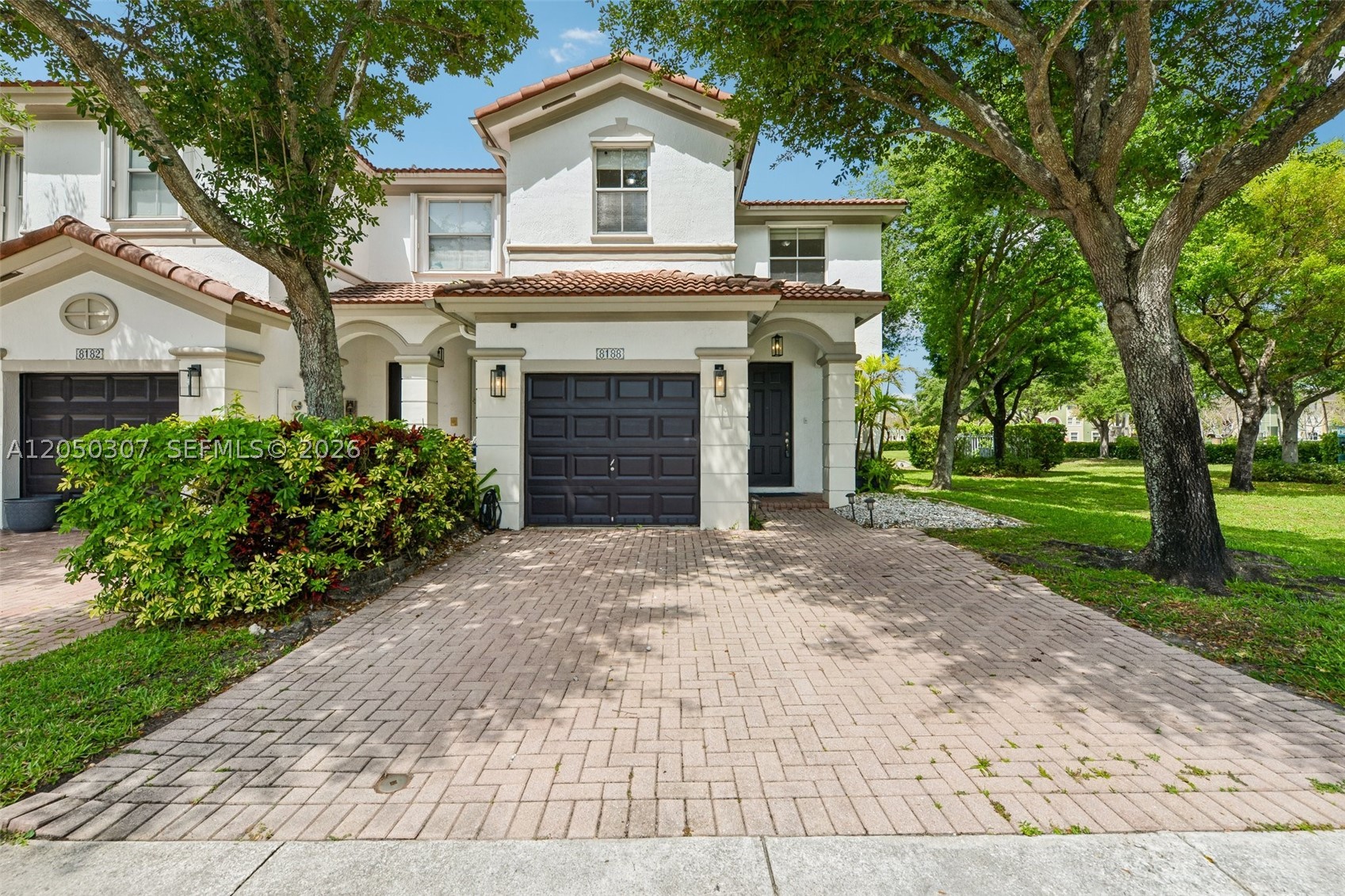 Don't miss this rare corner-lot townhome in the highly sought-after Antilles at Islands at Doral community! Unlike interior units with windows only at the front and rear, this 1,683 SF residence features additional side windows that fill the home with abundant natural light while offering charming park and lake views, enhanced privacy, and the added convenience of extra parking in the carport area—a valuable advantage over most interior units.
This beautifully maintained 3-bedroom, 2.5-bathroom home boasts a bright, open-concept layout at the ground level. The spacious primary suite overlooks the lake, creating a peaceful retreat, while two additional bedrooms provide the perfect space for family, guests, or a home office.
Clubhouse amenities include a resort style pool and playground. 
Just minutes from Doral's premier shopping, supermarkets, dining, top-rated schools, and convenient access to the 836 Expressway and Florida's Turnpike.