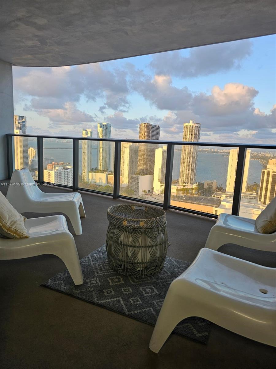 1 BEDROOM + DEN / 1.5 BATHROOMS...
Welcome to your future oasis in the heart of Miami! This FULLY FURNISHED exquisite rental property offers a serene retreat with its private balcony that boasts breathtaking views of the Biscayne Bay and the bustling Port of Miami. Imagine starting your day with the sunrise reflecting off the water, or winding down as the city lights begin to twinkle across the bay.

Nestled in the vibrant Downtown Miami neighborhood, it's 15 min. to the Miami International Airport, 5 min to the cruise port and train station making travel a breeze. The location couldn’t be more perfect for those who crave the excitement of urban living, with the best of Miami’s dining, shopping, and entertainment at your doorstep.