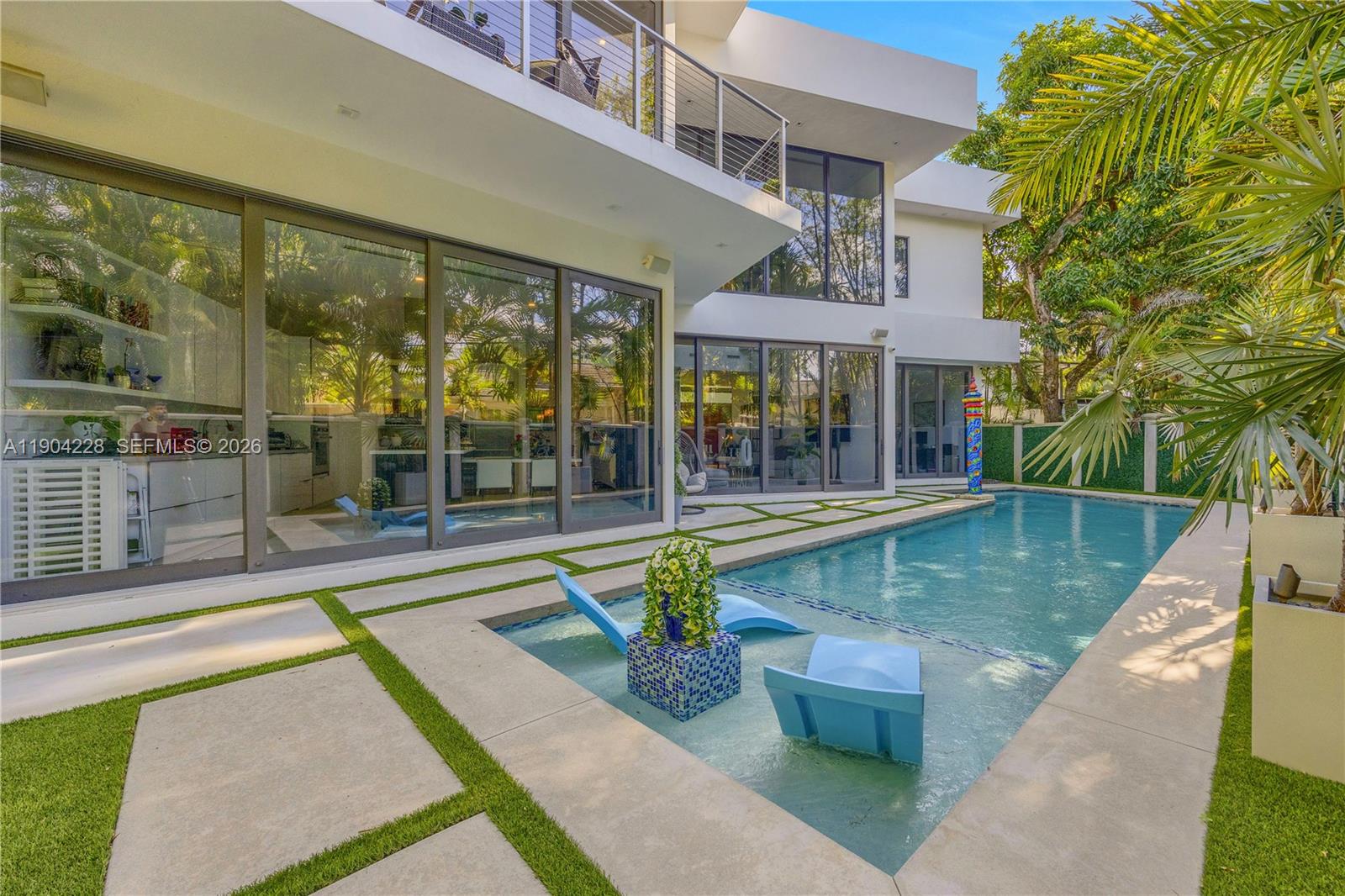 Experience Hollywood Glamour in the Heart of Coconut Grove. Discover modern luxury living in this stunning 5-bedroom, 5-bath residence, perfectly situated on a quiet cul-de-sac within the exclusive guard-gated community of Four-Way Lodge Estates. Built in 2019, this architectural masterpiece features an open-concept floor plan with expansive stackable sliding glass doors that seamlessly connect the main living areas to the pool and outdoor spaces-creating the ultimate indoor-outdoor lifestyle.  The gourmet kitchen, offers top-of -the-line finishes. Enjoy the prime location just moments from top-rated schools, scenic parks, and within walking distance of the vibrant restaurants, boutique shops and cultural attractions in downtown Coconut Grove.
