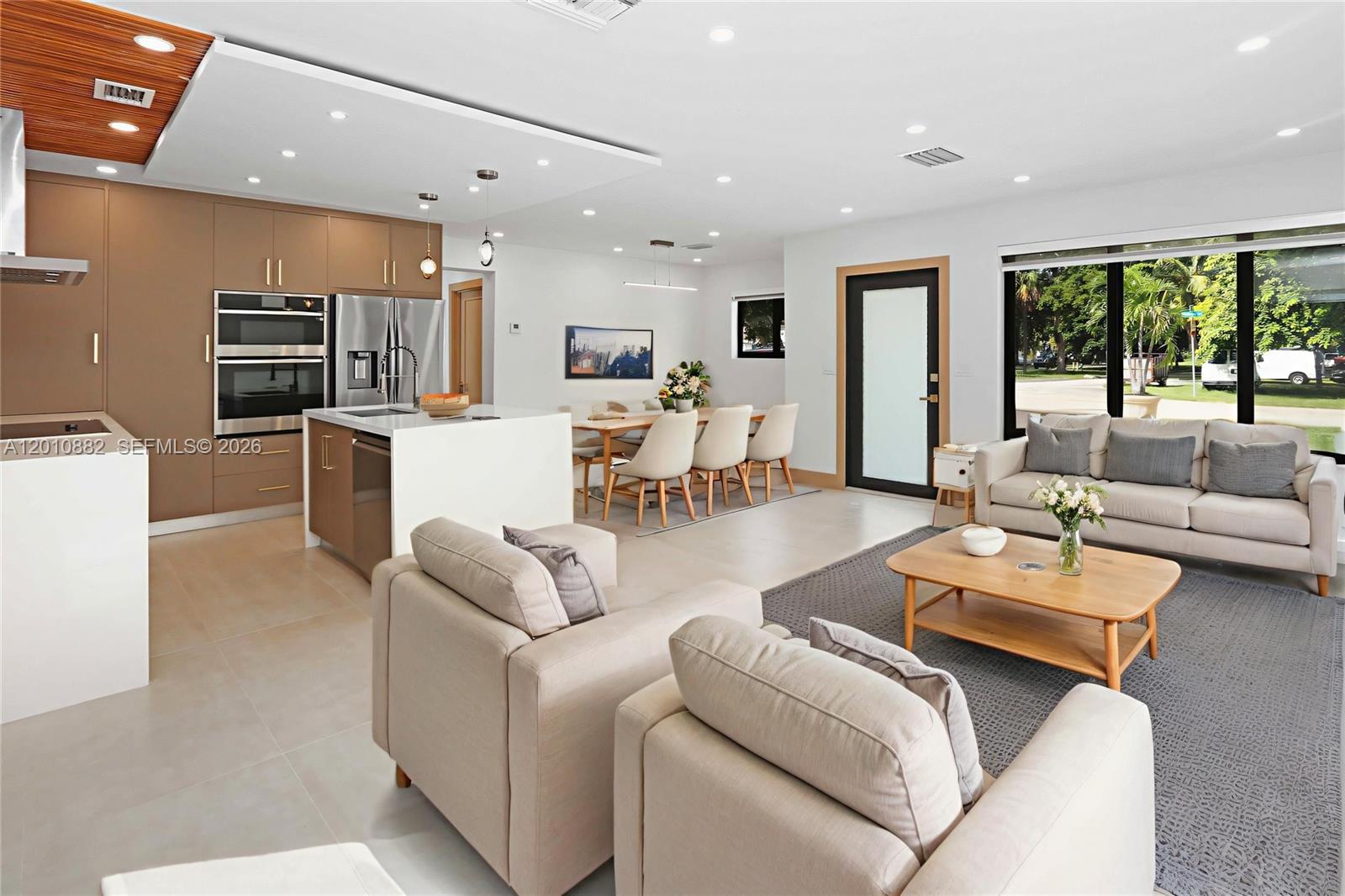 Experience the feeling of a new home in this beautiful, never-lived-in renovated corner property designed for modern living & entertaining. This 3-bed, 3-bath POOL home showcases exquisite craftsmanship throughout, featuring impact windows & doors, new roof, zebra blinds, & stunning finishes. The chef’s kitchen impresses with Italian cabinetry, brass hardware, waterfall countertops, & all-new Samsung appliances. Every bathroom is a showpiece w/ floating vanities, lighted mirrors, brass fixtures, & custom marble niches behind glass enclosures. Enjoy new porcelain tile flooring, recessed lighting, updated electrical & plumbing, & a spacious laundry room. The covered patio opens to a sparkling pool & fenced backyard w/ room for an RV or boat, 24x24 pavers, & custom exterior lighting.