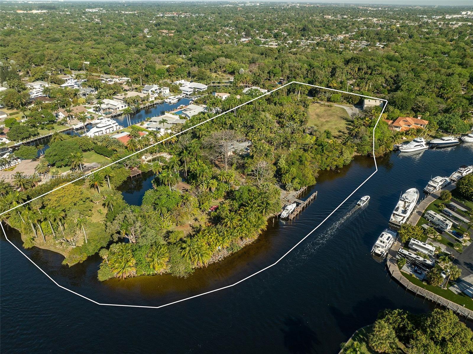 Prime waterfront oasis offering an expansive, breathtaking 7.2 acre point lot with deep water open access to the ocean; no fixed bridges. Unparalleled opportunity for boating and nature enthusiasts to build a family dream home or builder to create an exclusive private enclave of homes on the New River. Convenient proximity to the Beaches, Downtown, the Ft. Lauderdale and Miami Airport. Property includes House, Guest House and Helicopter Hanger.