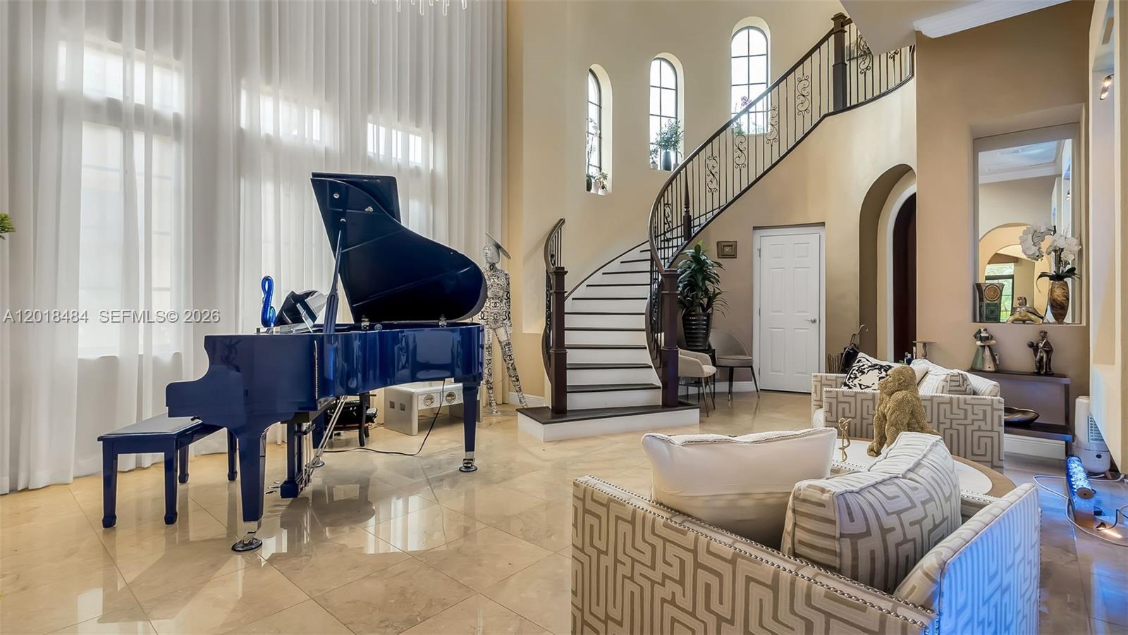 Step into the world of customized luxury. This 5 bedroom, 3.5 bathroom residence offers high end designer finishes throughout. Upgraded bathrooms featuring marble countertops, heated smart toilets and custom mirrors. New premium stone countertops in the kitchen and high end appliances. New fence, Zen landscaping , upgraded irrigation system  along with outdoor lighting. Perfect for entertaining during the day or at night. Designer drapes and light fixtures throughout. Roof replacement completed in 2025. All furniture purchased in 2025 and available for sale. Truly a turn key home. State of the art club house with optional golf membership. HOA initial contribution $1,750 and $1,460.46 quarterly, Sports Membership $20,000 and $757.94 monthly, Golf membership $80,000 plus $1829.77 monthly.
