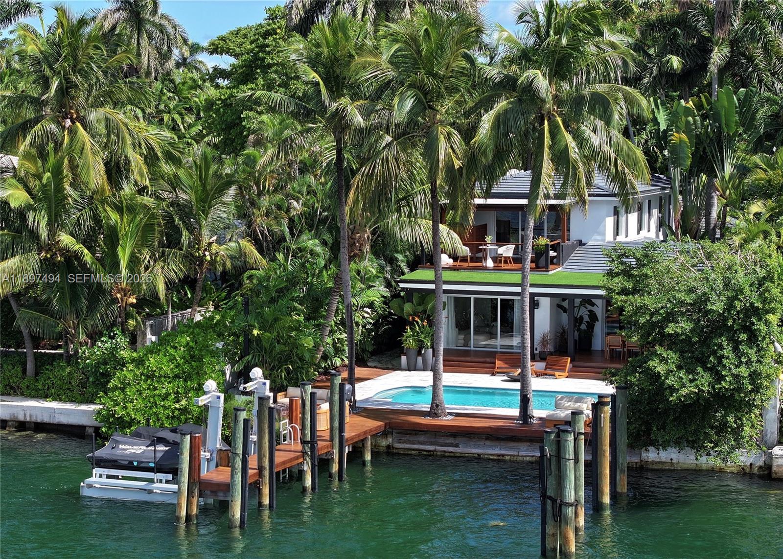 Dreaming of open bay and city skyline views? This newly remodeled waterfront home on the Venetian Islands has it all. With room for a 75 ft yacht, this 4-bed, 4-bath home offers both charm and modern sophistication. Light-filled interiors feature clean architectural lines, custom finishes, and a sleek kitchen and baths. The entire second floor is dedicated to the primary suite with a private terrace, steam shower, and floating tub overlooking the bay. The backyard includes a large pool, outdoor shower, covered lounge, and new deck ideal for entertaining. Offered under $13M, this home combines quality, move-in-ready convenience, and one of Miami Beach’s most desirable views.