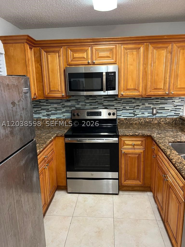 Beautiful and well-maintained 3-bedroom, 2-bath first-floor apartment located in a desirable and well-established community. Freshly painted and move-in ready, this spacious unit features an updated kitchen with granite countertops, stainless steel appliances, and plenty of cabinet space.

The open-concept living and dining areas are complemented by tile flooring throughout the common areas, while the bedrooms offer recently installed high-traffic laminate flooring for added comfort and durability. A full-size washer and dryer are conveniently located inside the unit.

Enjoy the benefits of a peaceful neighborhood with well-kept surroundings, while remaining close to shopping, dining, schools, parks, and major roadways. A perfect place to call home!

Easy to show and ready for immediate occupancy.