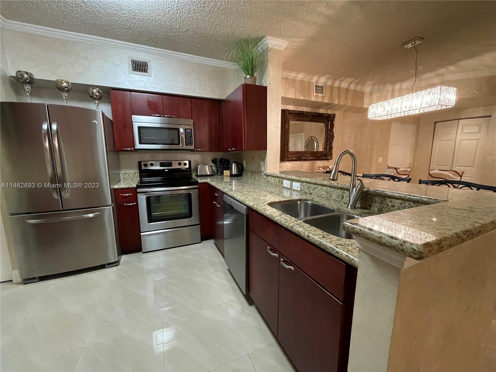 Upgraded fully furnished 2 bedroom 2 bathroom split floor plan with 2 walking closets, tiles throughout , upgraded kitchen with granite counter top and stainless steel appliances, extra kitchen cabinets, bathrooms are upgraded with stone counter top, king size beds, extra large sofa, 3 large TV's. inside laundry room with new washer and dryer. walking distance to the beach, shops, restaurants and school.