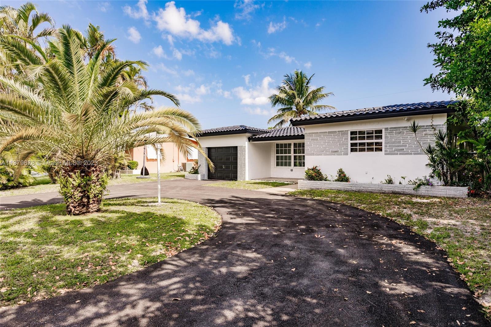 Welcome to an open remodeled floor plan located on a quiet cul-de-sac in Pines Village, Pembroke Pines. Features 3 Bedrooms, 2 Baths, 1 Car Garage, Rear Enclosed Screen patio, and a Large Den that can be used as a 4th bedroom. Providing over 2,000 sq ft of living area with Wood Cabinets and Carrara Quartz countertops. Other features include: Laundry room with Wood Cabinets and Carrara Quartz countertop, New Washer and Dryer, New Samsung Stainless Steel appliances, New Vinyl flooring in Master bedroom and guest bedroom. Enjoy New A/C unit, Modern energy efficient LED lighting throughout. The Master bedroom offers a walk-in closet and  walk in shower. This home is located in an ideal spot, close to shopping, restaurants, and easy to access the Florida Turnpike. No HOA, Turn-Key Ready!