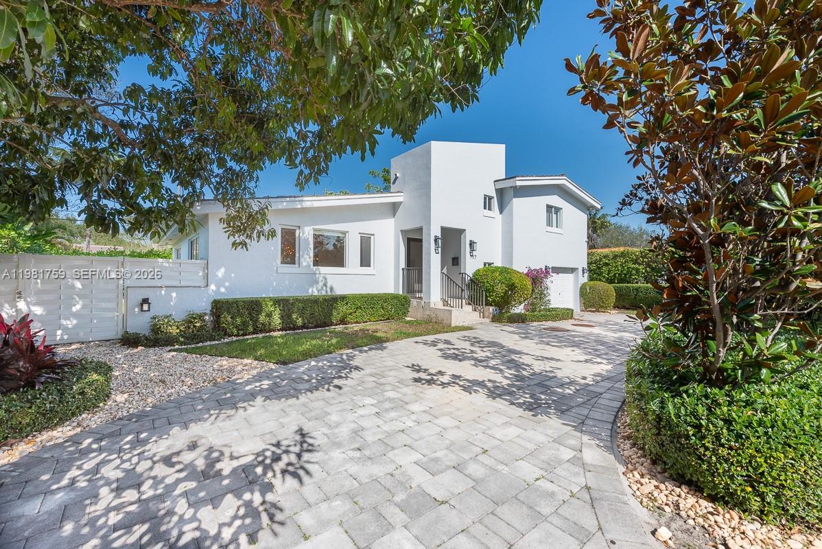 Experience the ultimate Coral Gables lifestyle in this stunning, 3BR/2.5BA turnkey residence. Nestled on a quiet, tree-lined street near the University of Miami and world-class dining, this home is built for comfortable family life and easy entertaining. The light-filled interior features a vaulted ceiling, and a seamless open layout with impact windows and doors throughout.
The beautiful custom kitchen features a social island, wood cabinetry, granite countertops, and gas range. The practical floor plan includes a massive family room, a dedicated bar, a private closed office, and ample storage—including custom built-in closets in every bedroom and walking closet in the master bedroom. Outside, a deep covered terrace offers the perfect year-round space for relaxing or hosting, overlooking a private heated pool and a lush tropical garden. Additional features include a mature mango tree in the front and electrical car port. 
* Easy to show!!  Text Listing listing agent
* Buyer must have Preaproval Letter - Proof of funds. * Offers on FAR/BAR AS IS contract.