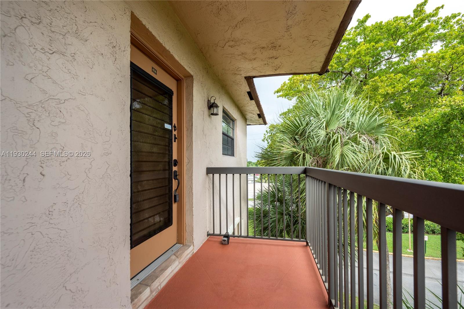 PRICE REDUCTION!! MOTIVATED SELLER!!!!!  ----- SELLER TO PAY 3 MONTHS OF THE ASSOCIATION FEE FOR THE BUYER, Beautifully furnished, fourth floor CORNER condo. TURN KEY spacious 2/2 offers over 1200 sq ft of living space. Located in the highly sought after community of Lakes of Carriage Hills. Bright & open impeccably kept. Updated throughout with gorgeous wood flooring. Two large separated bedrooms with spacious walk in closets, large separate laundry room with full size washer & dryer and extra storage. Screened and tiled patio with hurricane shutters. Enjoy strolls on the walking paths & bridges throughout this maintained 55+ community. ASSESSMENTS HAVE BEEN PAID - Clubhouse activities, 2 heated pools, tennis courts, shuffleboard & much more just steps from your front door. Cable, internet & water arE included in the assoc fee.