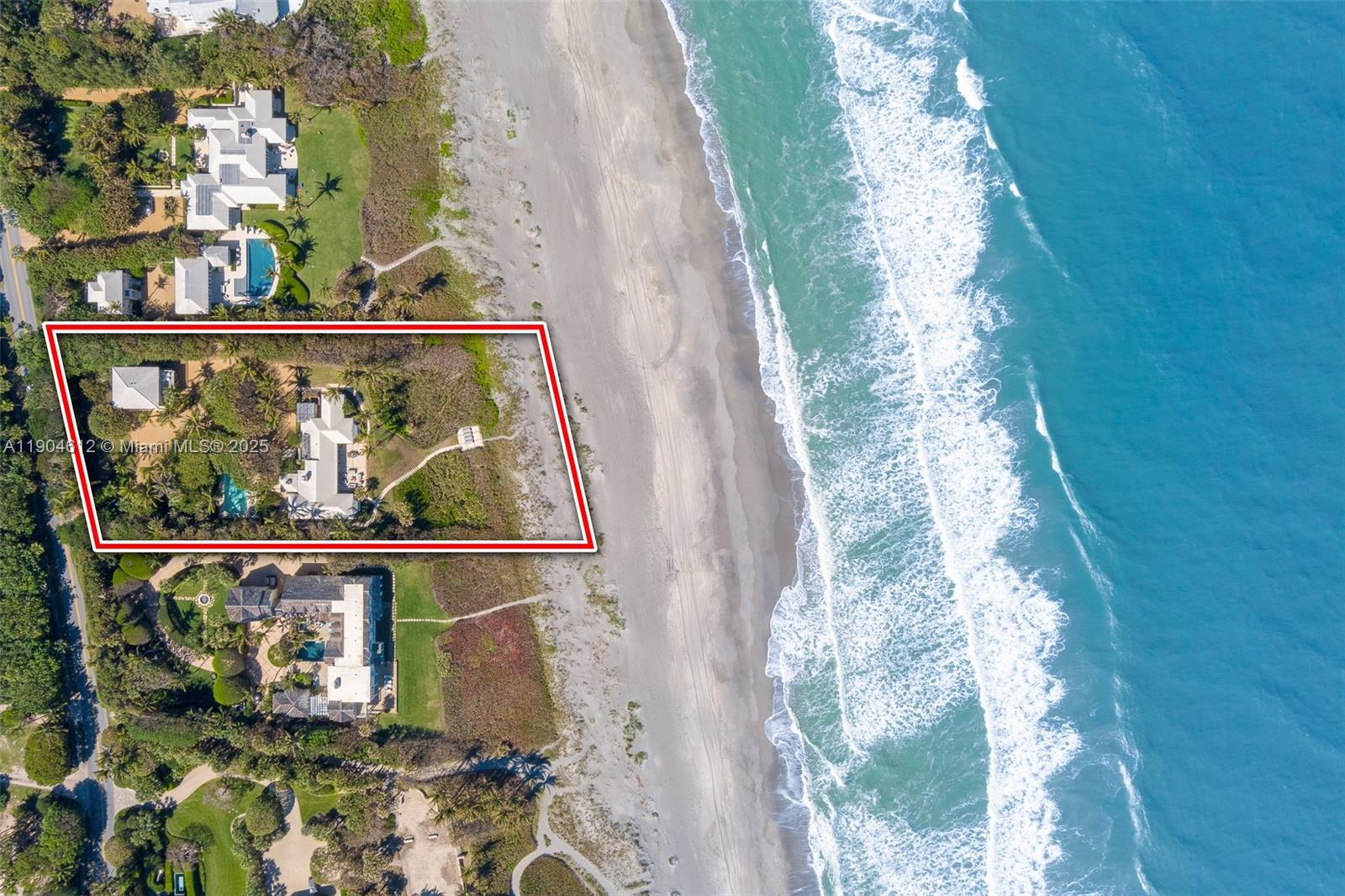 Welcome to your exclusive beachfront sanctuary on Jupiter Island. Set on ±1.6 acres of pristine shoreline with 170 feet of direct ocean frontage and a rare 23-foot elevation, this unique estate offers breathtaking views and exceptional privacy. The main house features 4 bedrooms and 4 bathrooms, with sun-drenched living, dining, and family rooms that open to sweeping ocean views and an expansive terrace ideal for entertaining. 
A 1-bedroom, 1-bathroom guest house with living area and kitchen, along with a 3-car garage featuring a half bathroom and storage, complete this exceptional property. 
Surrounded by lush landscaping and an iconic pool, this timeless retreat also offers room to expand - a rare elevated estate set on one of Jupiter Island’s highest and most desirable vantage points.