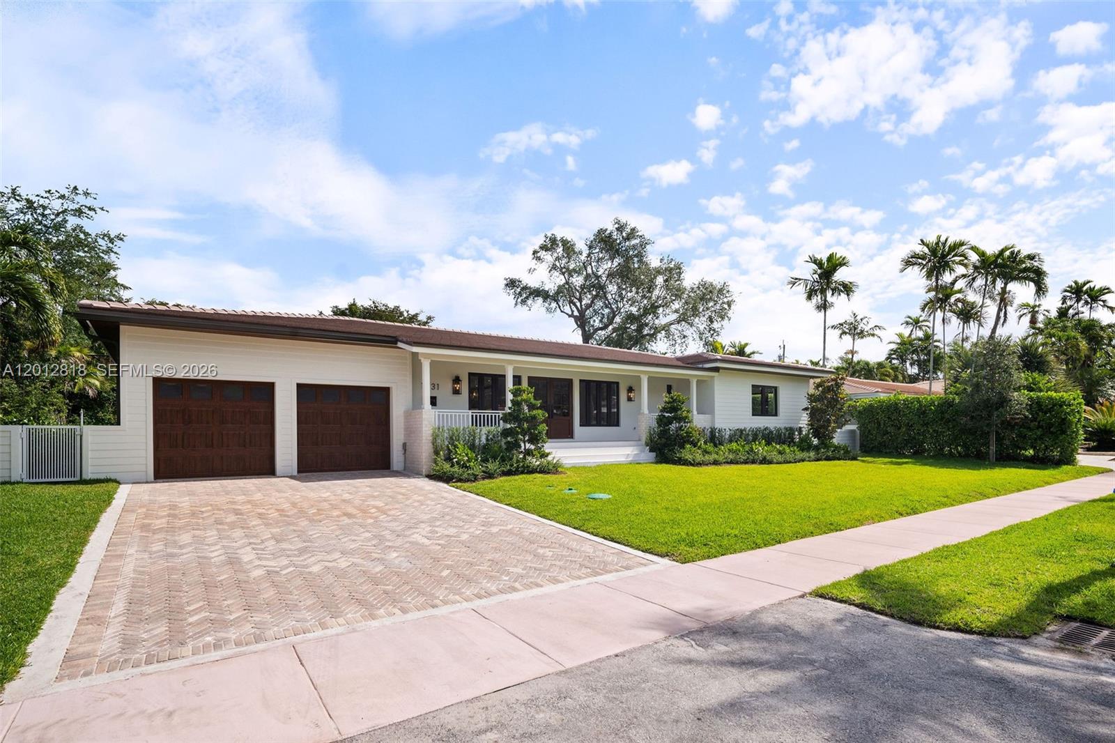 A rare opportunity to own a newly built contemporary residence in the highly sought-after Coral Gables Riviera. This new construction home offers 4 bedrooms, 3.5 bathrooms + den, 3,674 SF total, and 3,050 SF under A/C, with exceptional craftsmanship and elevated finishes throughout.
Designed with a bright open floor plan, the home features soaring ceilings, expansive living spaces, and abundant natural light. The custom kitchen is outfitted with real white oak cabinetry, quartzite countertops, a large center island, Sub-Zero &  Wolf appliances, and refined natural wood millwork paired with marble & premium stone finishes.
Indoor and outdoor living blend seamlessly with direct access to the pool and covered summer kitchen, creating the perfect setting for entertaining. The primary suite features direct backyard access and an oversized walk-in closet, while the secondary bathrooms are thoughtfully designed with custom vanities, premium natural stone, designer fixtures, frameless glass showers, and elevated finishes that mirror the home’s refined aesthetic.
Additional highlights include marble surfaces throughout, a laundry room finished with Taj Mahal quartzite, natural gas service, dual Carrier Infinity A/C systems, marble pavers, tongue-and-groove overhangs, and custom 2 car garage with ADCO walnut-finish garage doors.
A timeless blend of modern luxury and classic Coral Gables elegance, ideally located near the University of Miami and Riviera Country Club.