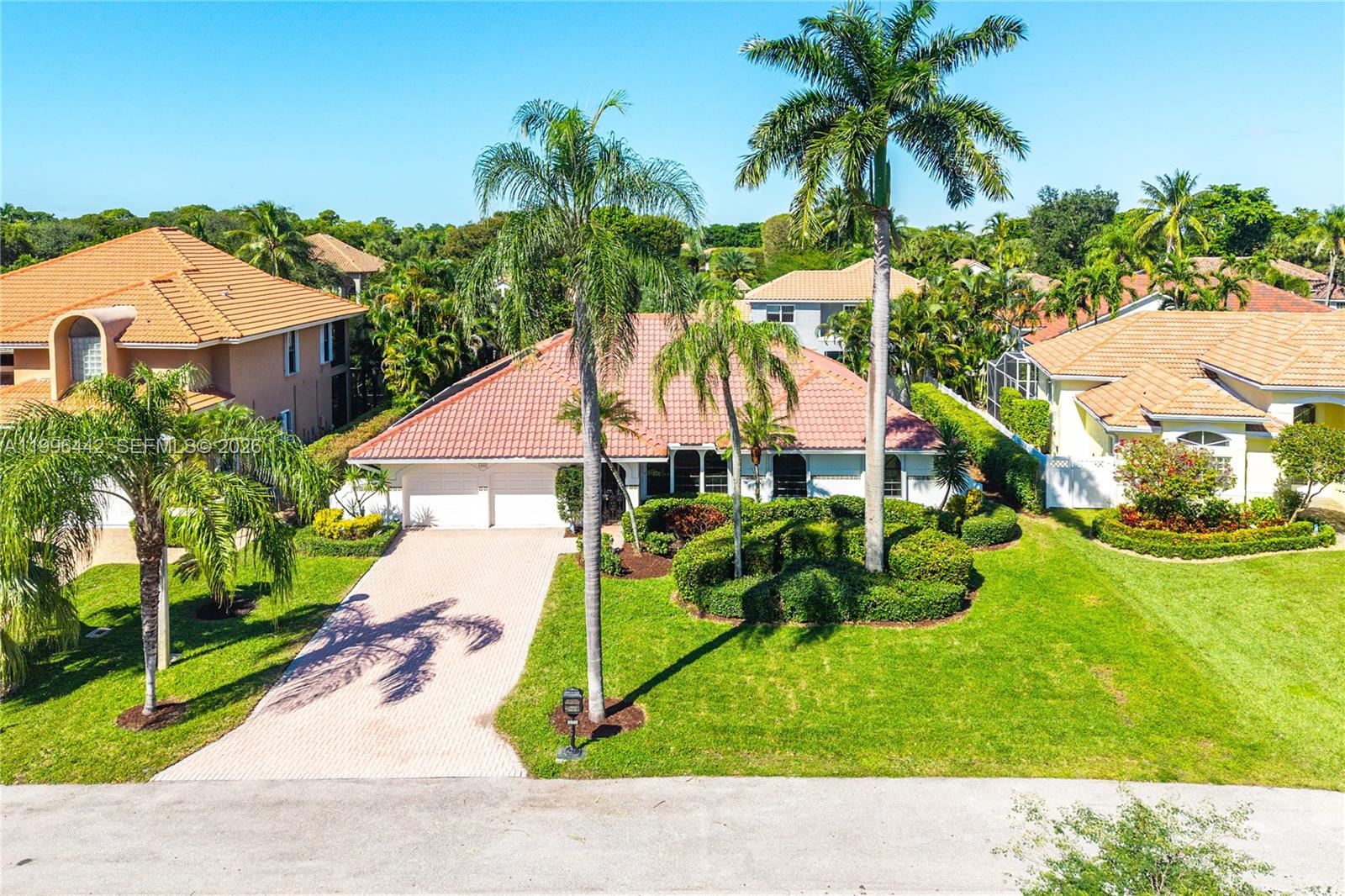 Welcome to the gated community of the Cloisters in Boca Raton. This well-maintained home features 4 bedrooms, 2 bathrooms, 2,300+ sq ft, and a screened-in pool! Beautifully updated 4-bedroom wing featuring wide-plank engineered oak floors, new baseboards, interior doors, and modern hardware. The primary suite overlooking the pool boasts a designer, lighted walk-in closet and a stunning new spa bathroom finished with Calacatta Gold Marble and handcrafted Moroccan Zellige Tile. Fresh interior paint throughout, plus a newly painted exterior (2025) and a professionally cleaned roof (2025). The kitchen has been preserved with their authentic charm. Leaving the new owner the opportunity to create their own vision or continue to enjoy it!
