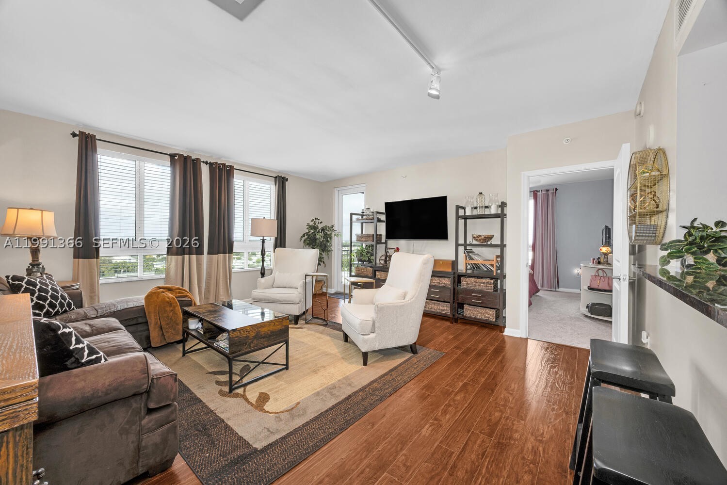 Located in the heart of Dadeland, this beautiful 2-bedroom, 2-bath unit is positioned in the sought after corner line of the Toscano Condominiums. This spacious 1,155 SF residence is offered furnished and features an open-concept living, dining, kitchen layout with wood flooring throughout and abundant natural light. The modern kitchen is equipped with stainless steel appliances, granite countertops, and sleek wood cabinetry, opening seamlessly to a convenient breakfast bar—perfect for casual dining and entertaining. The living and dining areas offer a comfortable flow, ideal for both everyday living and hosting guests.The primary suite is generously sized with a shower/tub combo and walk-in closet, while the second bedroom provides flexibility as a guest room, home office, or home gym. Enjoy a well-designed floor plan with ample storage and convenient hallway laundry room. Enjoy city and sunset views from the private corner balcony off the living room. Includes 1 assigned covered parking space. Building amenities include pool & spa, fitness center, residents club room w. catering kitchen, meditation garden, dog park, valet parking, 24hr security concierge services and more. Prime location just steps from local eateries, Dadeland Mall, and MetroRail station for easy access to UM / downtown Miami. This is a great opportunity to build equity in a highly sought-after building!