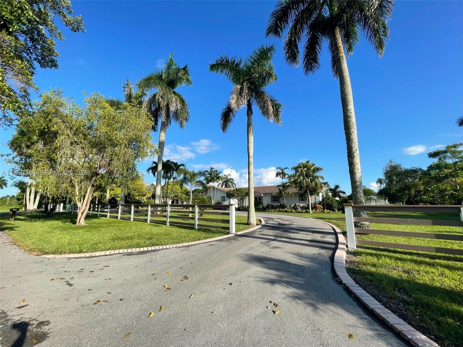 Fully Renovated Redland Equestrian Estate 2.2+ acre modern living with horse stables and pool.  The Master Bedroom features dual walk-in closets and a spa-inspired bathroom with a 40 jet Jacuzzi tub and sauna. Three additional bedrooms are fully furnished, plus a separate large room, close to the family room is design and set up as a game room. The estate recently underwent a $1M+ complete renovation, updating every detail—new tile roof, impact windows and doors throughout, new AC units, all new kitchen cabinets and appliances, new bathrooms vanities and fixtures, 4’ x 4’ porcelain tile flooring throughout. In addition to the main home, there is a separate 1 bedroom 1 bath with full kitchen and living room for either in-laws’ quarters or guest house.
