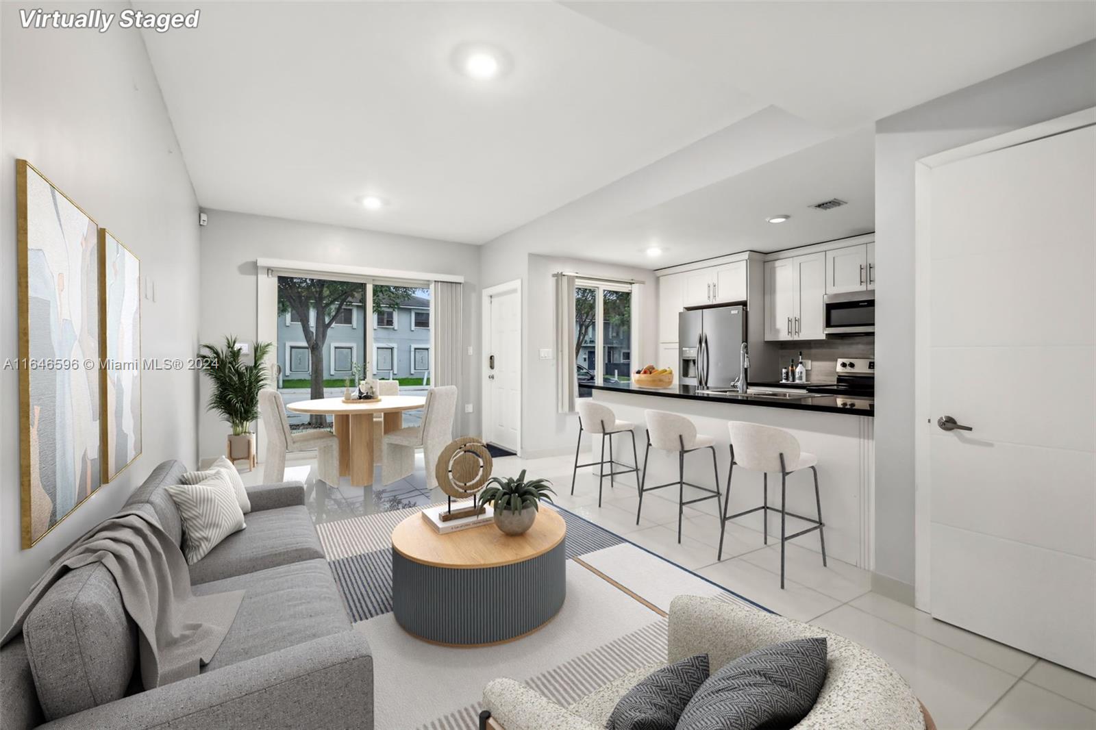 This beautiful newer-construction townhouse offers 4 bedrooms, 3.5 bathrooms, and a variety of modern amenities. The first floor features a bedroom with a full bathroom, perfect for guests or an in-law suite. Enjoy easy access to the turnpike, a private fenced patio, and a balcony overlooking the front of the property. The home has high-impact windows and doors, ensuring safety and peace of mind. With durable concrete walls and a thoughtfully designed layout, this townhouse is stylish and secure. Come and check it out!