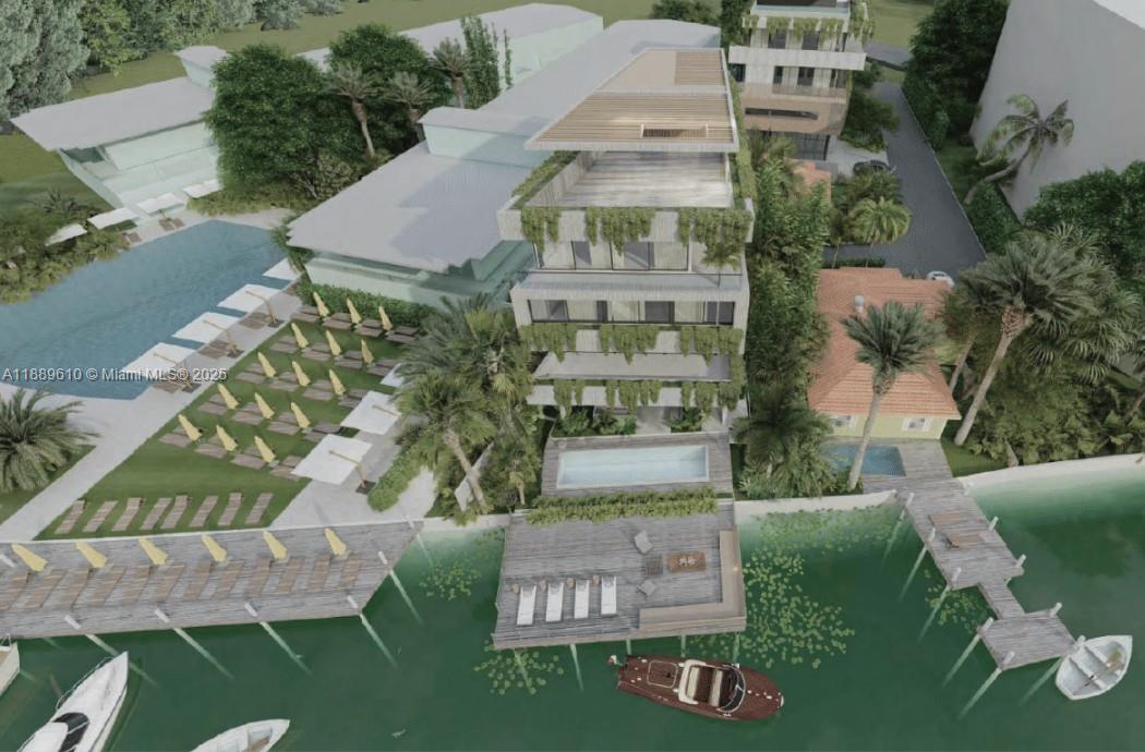 Rarely available waterfront gem beside The Standard on the Venetian Islands. This 3BD+den, 2BA home offers light-filled open interiors with sweeping bay views and seamless indoor-outdoor living. Ideal to renovate or redevelop, the property features lush landscaping, a large entertaining deck, and potential for a private dock. Zoned RM-1 with 1.25 FAR and up to 5 stories, it offers endless potential—whether to craft a modern masterpiece or a multi-level luxury retreat in one of Miami Beach’s most coveted locations and walkable access to Sunset Harbour Miami Beach’s top restaurants.