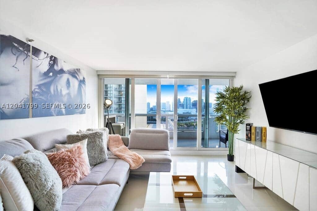 Rarely available 4 bedroom 3 full baths comes furnished, turn key, stunning views of downtown skyline that leave you in awe  'Some like it Hot ' this is the ultimate purchase. With South Beach 3 miles away you, family or friends can indulge in the sandy beach with the energy of Downtown Miami as the ultimate Miami experience.