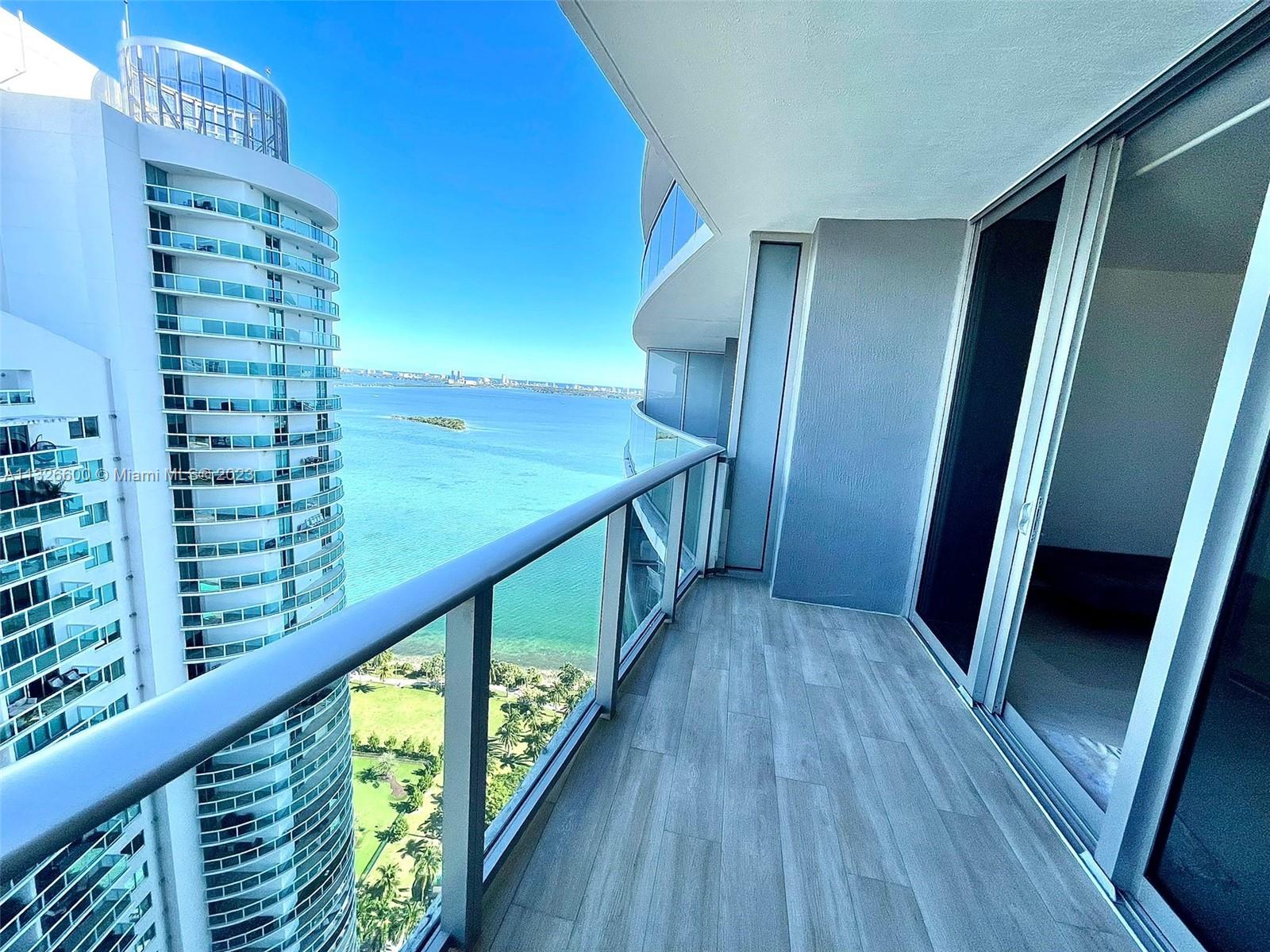 SELLER MOTIVATED! Luxurious Brand New Condo with Spacious 1 Bedroom + 1 Den / 2 Full Bath, a large balcony overlooking the ocean and city and porcelain floors. Den has been enclosed as a second bedroom and a spacious closet added. Aria is a new building with spectacular views, amenities and a beautiful park across the street. Unit has ceramic floors, kitchen with top of the line appliances, Built In Closets and blackouts and solar shades. One assigned parking space, two pools, gym, valet parking and nicely appointed party rooms. Price negotiable.