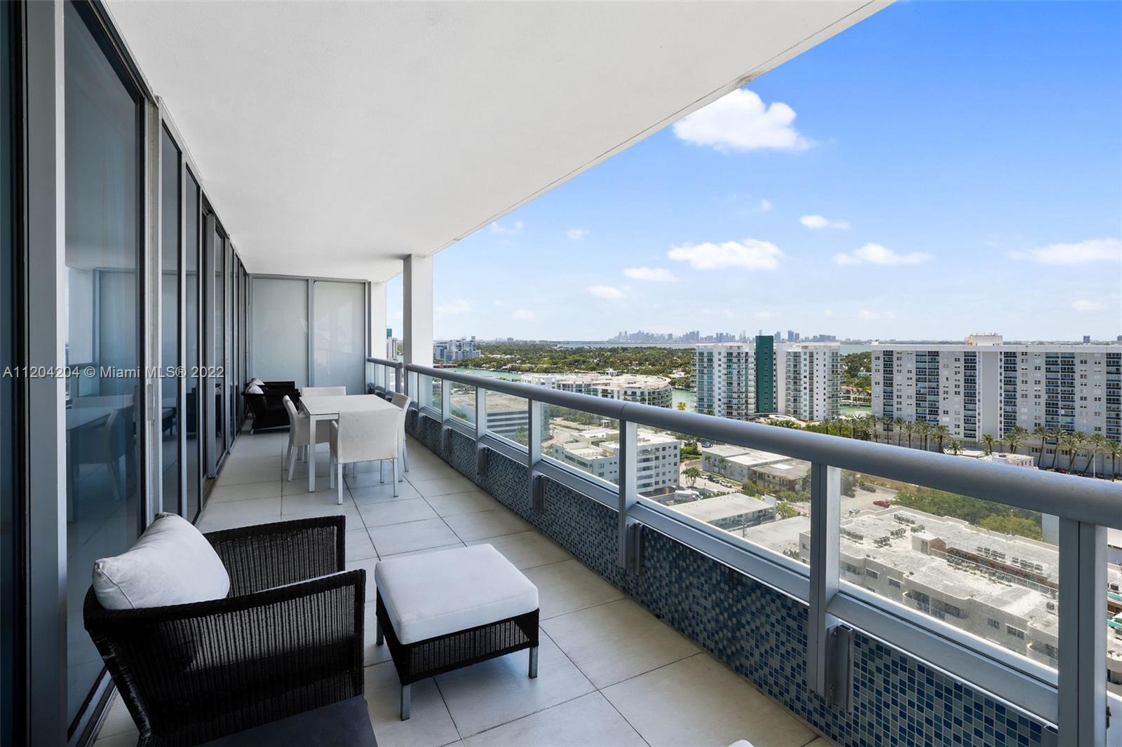 Stunning sunset, panoramic city, bay views from most desirable west view floor plan unit at Carillon Miami Wellness Resort, a premier oceanfront property. Huge deep balcony of 500sq/ft outdoor dining & living space accessed from all rooms. Unit upgraded with build-ins in living and bedroom.  Easy access through indoor walkway to hotel and 70,000 sqft fitness spa center.  Salon; 4 pools; concierge; restaurant; Corner Store; beach service, bar, 24-hour security, valet, & full array of wellness services. Owner receives $200 each month in Carillon credits. Fitness classes from morning to early evening 7 days a week, all included. Quiet walking neighborhood with all conveniences, including Publix across the street. Give yourself the gift of living a lifestyle of luxury, vibrancy, and wellness