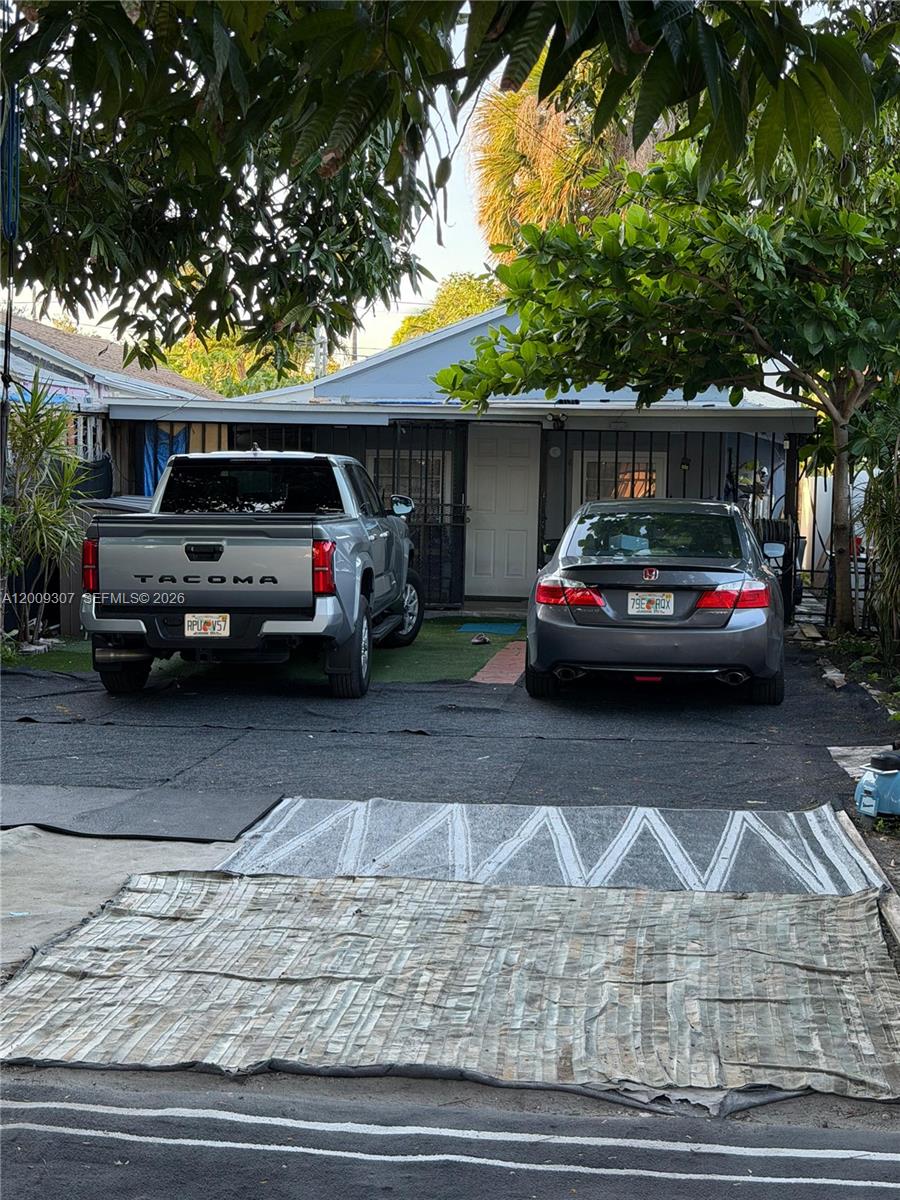 Excellent investment opportunity featuring a versatile multi-unit setup: a 3-bedroom, 1-bath main home, a 2-bedroom, 2-bath unit, and a 1-bedroom, 1-bath efficiency. Situated on a spacious lot in a centrally located area close to major conveniences, this property offers strong income potential and flexible living arrangements. Perfect for investors or homeowners seeking additional rental income. A project almost approved for a modern duplex up to 5,400 sf. Duplex consisting of two units: 1111 NW 26th St and 1113 NW 26th St.
