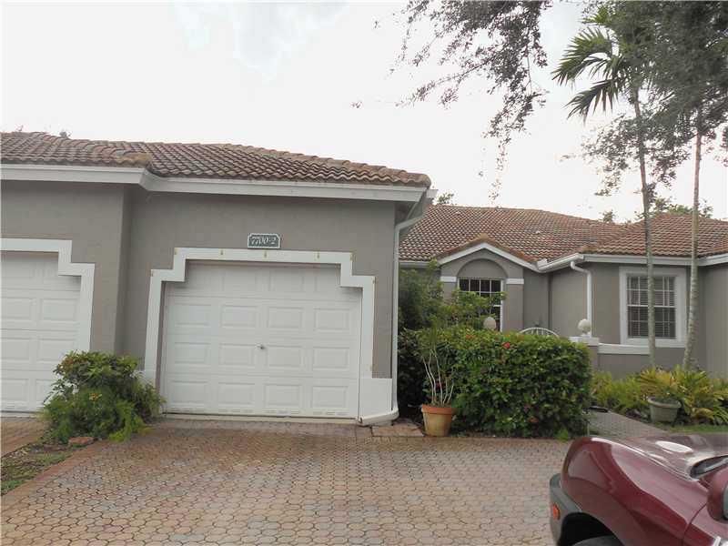 This impeccably maintained townhouse features 2 oversized bedrooms, 2 bathrooms and nice screened in patio.  Property has a full size washer and dryer in large laundry room, and also will have brand new kitchen appliances prior to move in.  Home is an att ached one car garage and driveway parking for 2 additional cars.  Property is in a gated community which features a full clubhouse, golf course, swimming pool and state of the art gym.  Move in with only $3300!!!