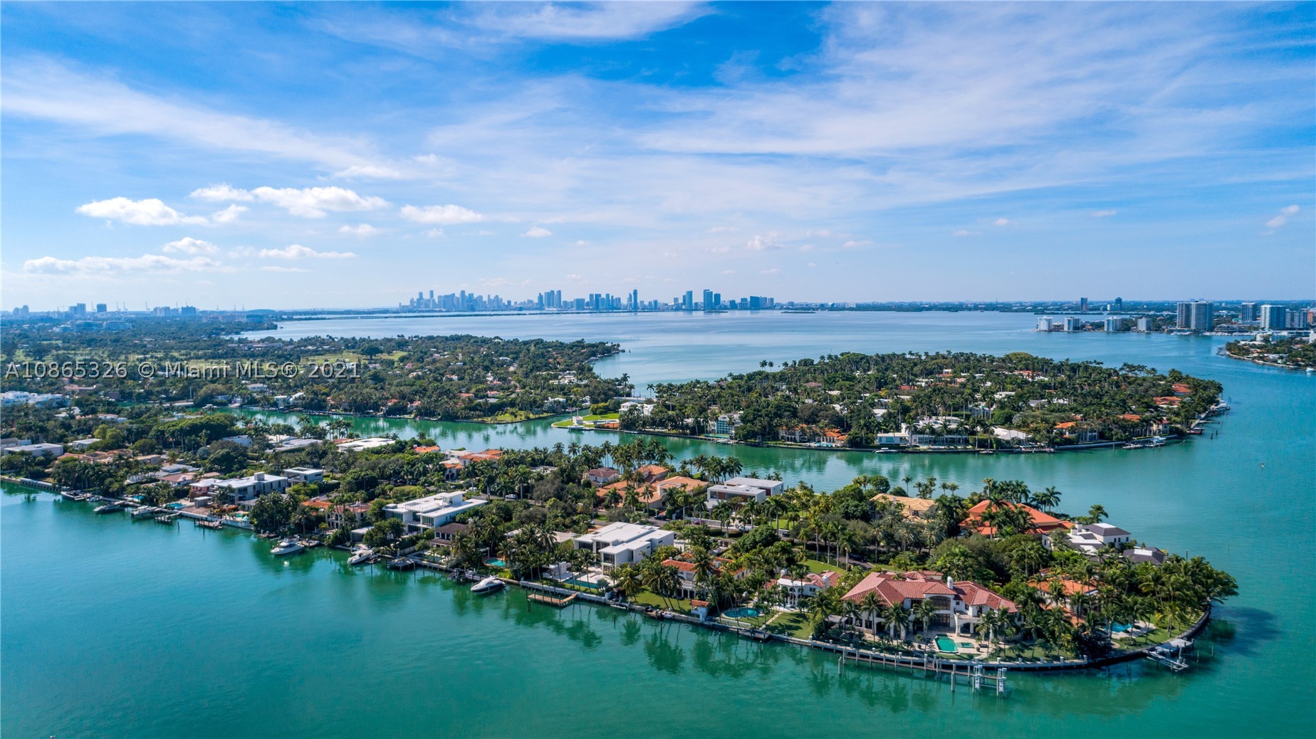 Beautiful new construction modern farmhouse on guard-gated Allison Island is one of a kind. Designed by architect Max Strang, the tasteful home boasts over 7,000 sq. ft. under HVAC, on a 16,200 sq. ft. lot with 75 feet of prime water frontage, dock and no fixed bridges. The large chef’s kitchen features appliances from Wolf/Sub-Zero, Boffi cabinetry and custom marble slab, accompanied by Dornbracht plumbing fixtures. Salvatore marble tile throughout the bathrooms adds a touch of elegance. 12’ ceiling height on the main level allows natural light to flood the entertaining spaces laden with wide-planked European white oak flooring. Lush landscaping creates a sense of privacy and tranquility. Other features include a security gate, attached two-car garage with custom glass doors, smart home.