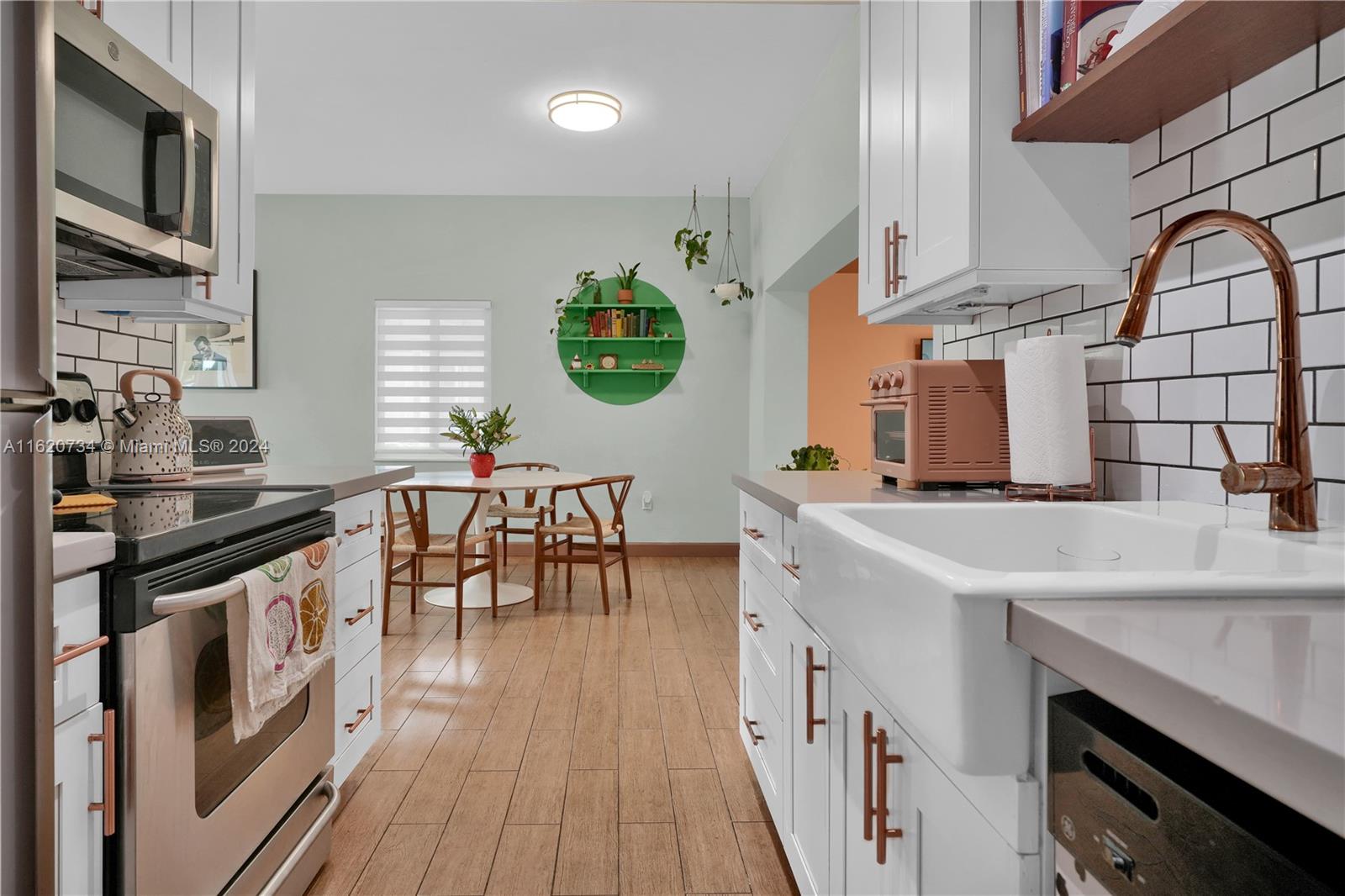 This beautiful turnkey home features an updated kitchen with quartz countertops, white solid wood cabinets, large farm sink, subway tile back splash, and high end appliances. The home features an open layout that is flooded with natural light, impact windows and doors 2017, updated plumbing and electrical, updated bathroom, built-in closets, A/C ducts replaced in 2018, covered carport and driveway, laundry room with new water heater, and a fully fenced private backyard with large patio area perfect for entertaining and equipped with shade sail. Centrally located, the home is nestled in between David Fairchild Elementary, Coral Gables, and South Miami. 15 minutes to the airport and 25 minutes to Miami Beach.